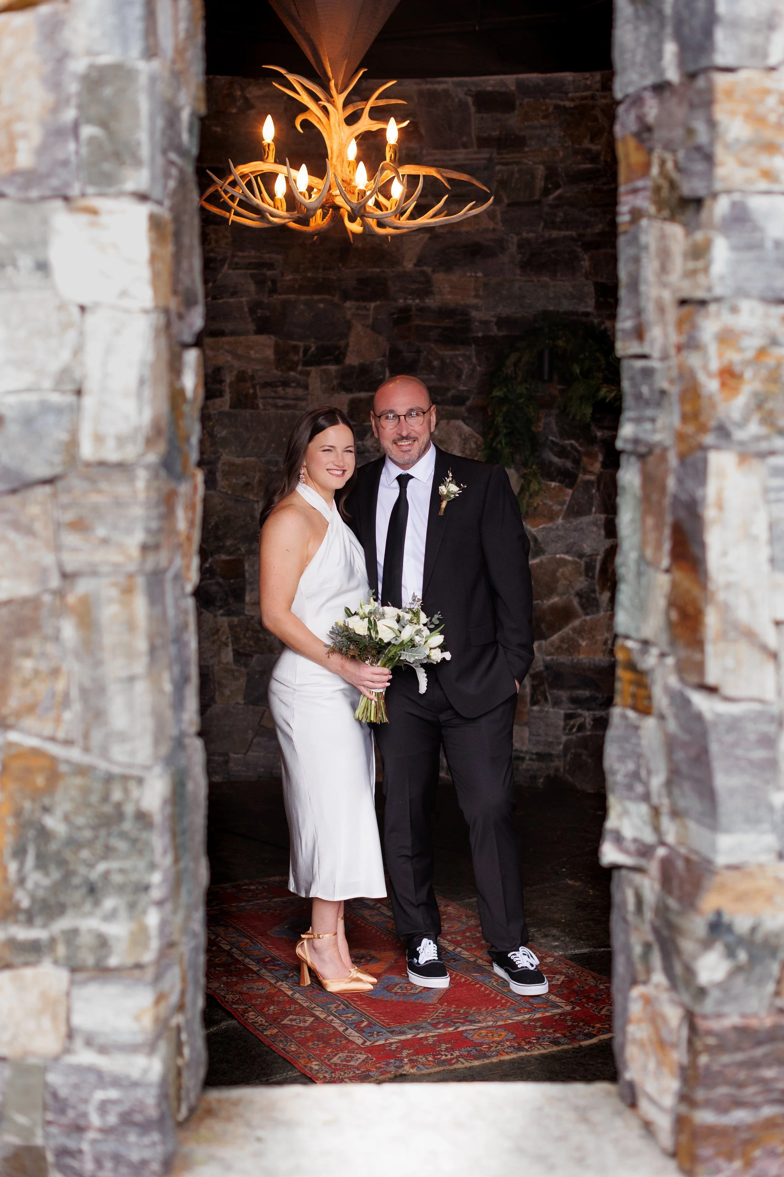 Outdoor winter elopement ceremony by the fire at Lake Placid Lodge in February