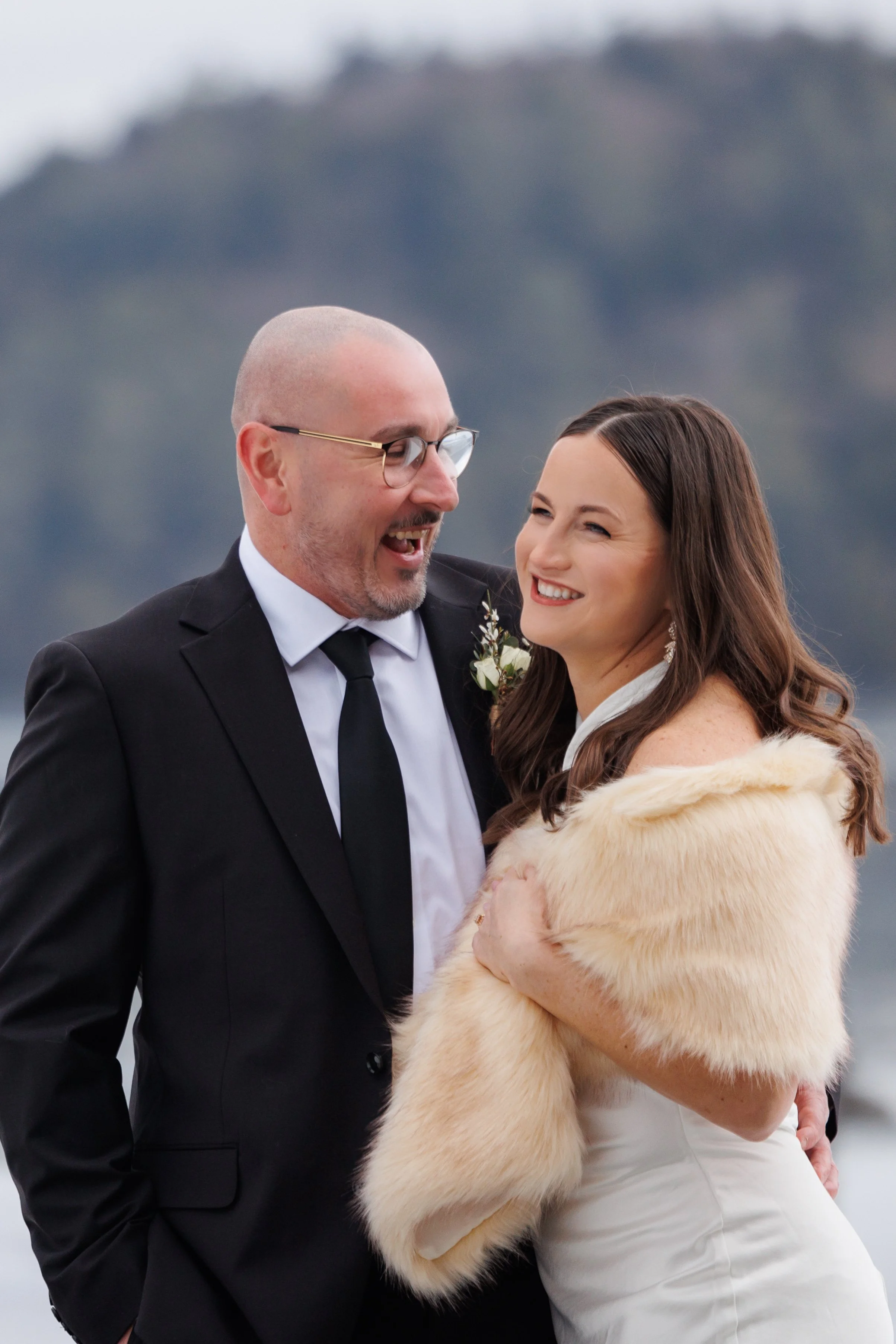 Candid moment of bride and groom laughing during Lake Placid Lodge elopement