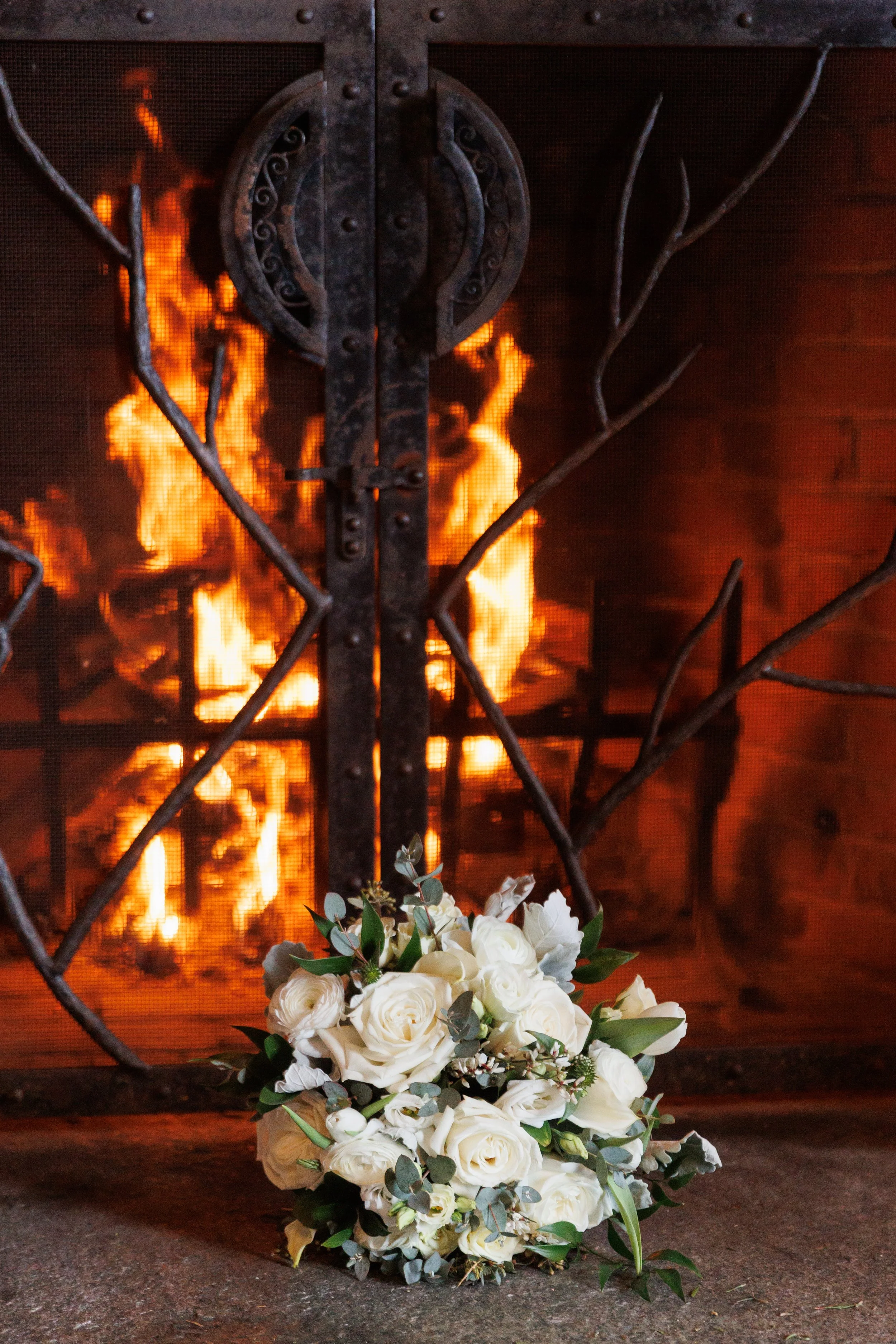 Outdoor winter elopement ceremony by the fire at Lake Placid Lodge in February