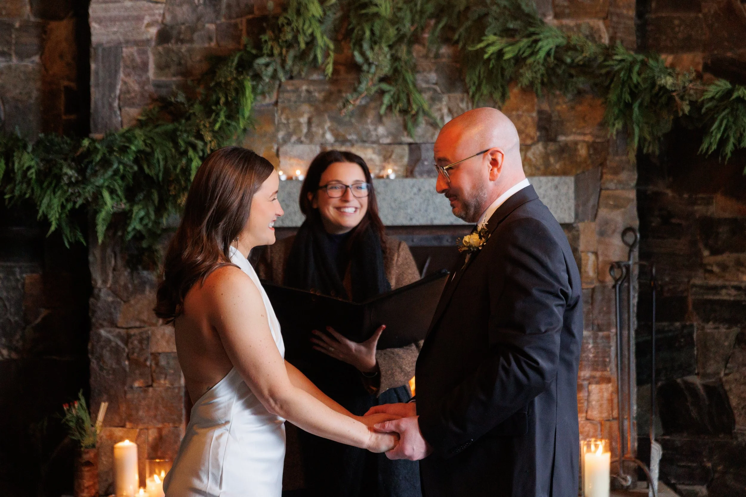 Outdoor winter elopement ceremony by the fire at Lake Placid Lodge in February
