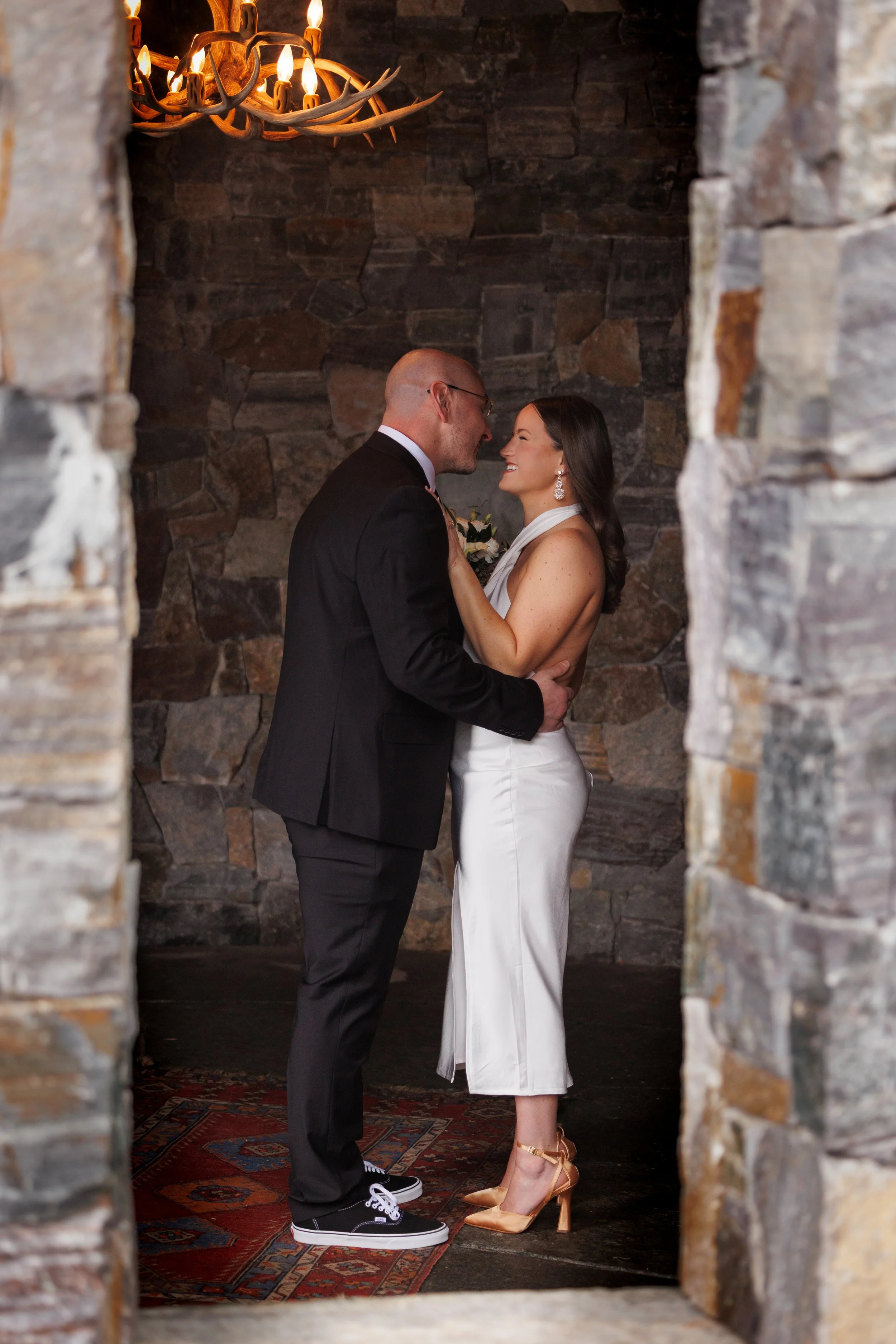Outdoor winter elopement ceremony by the fire at Lake Placid Lodge in February