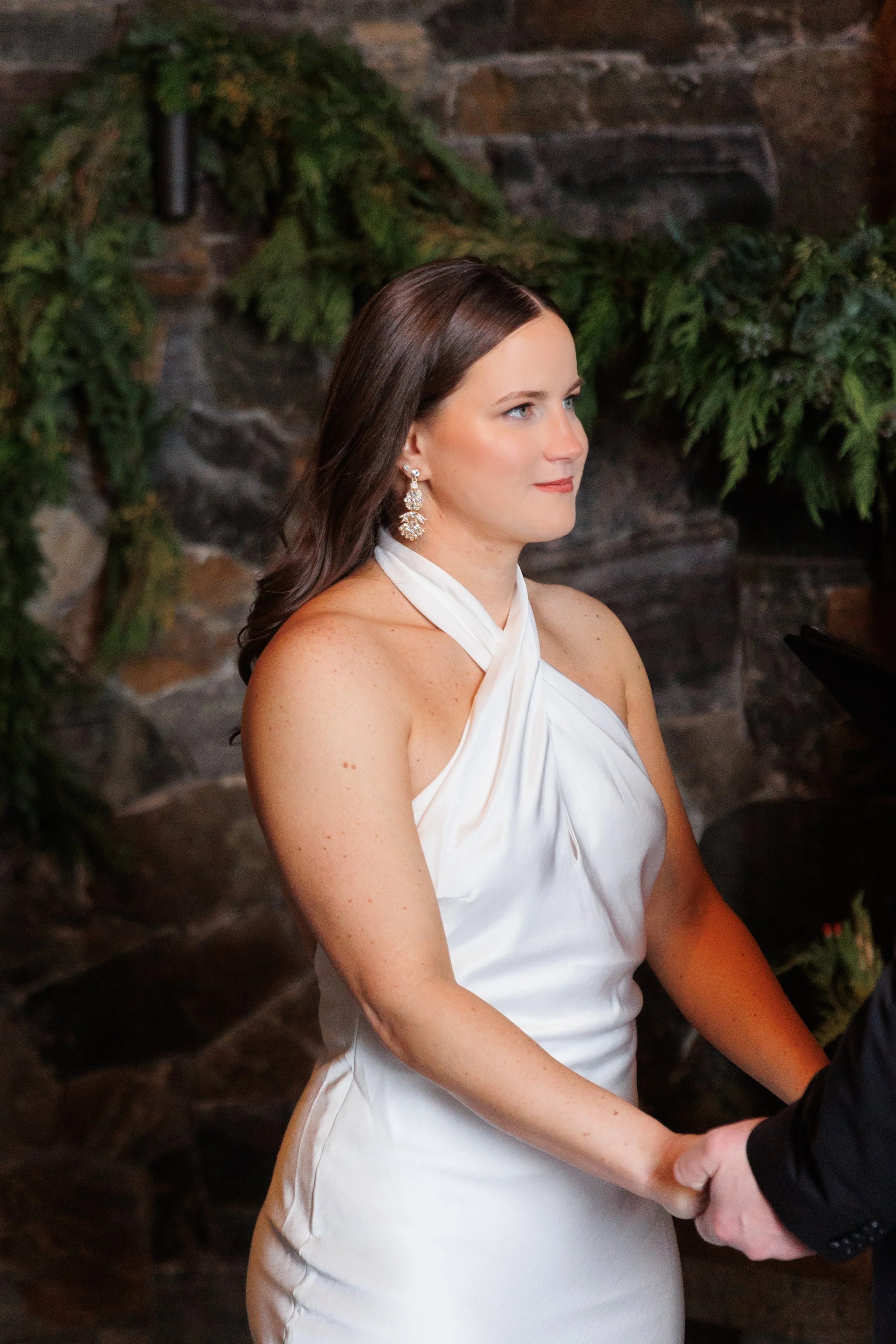 Outdoor winter elopement ceremony by the fire at Lake Placid Lodge in February
