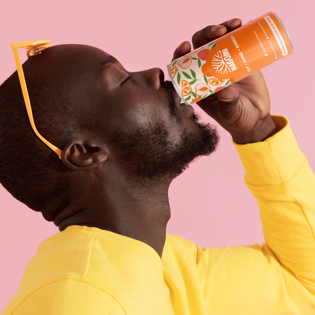 Young persom enjoying a can of Nagomi Drinks, Orange Blossom and Peach Flavour