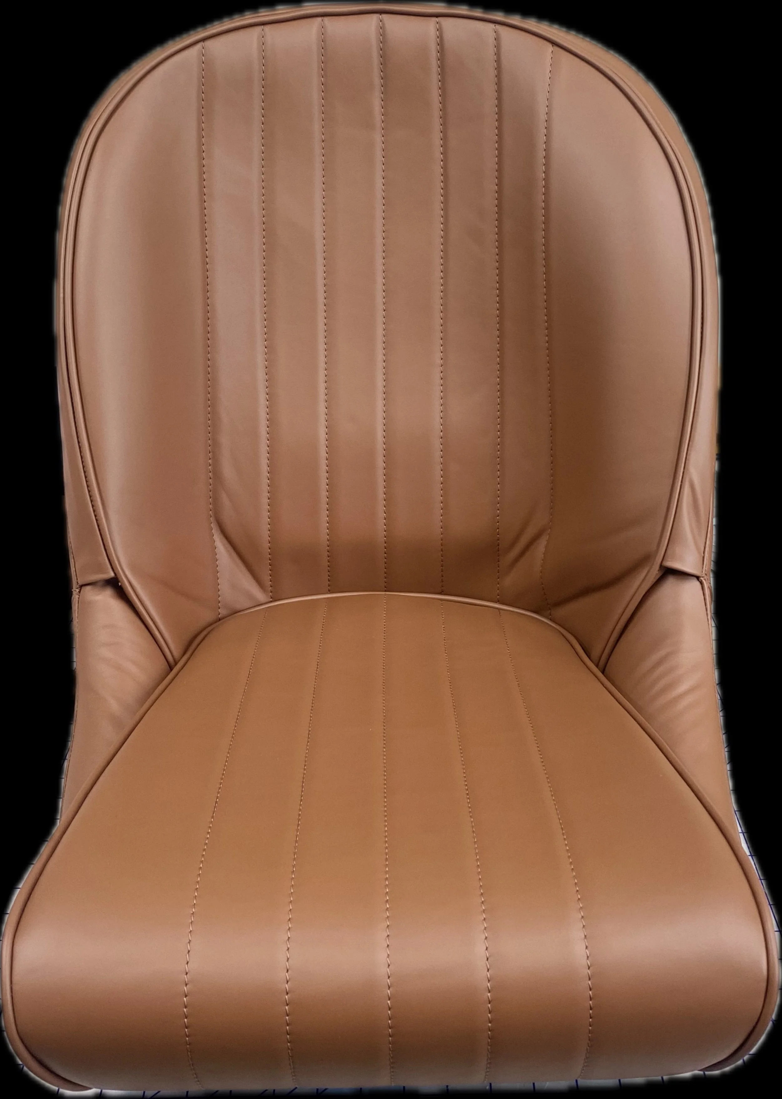 A tan leather chair with vertical stitching, rounded back, and seat with visible stitching details.