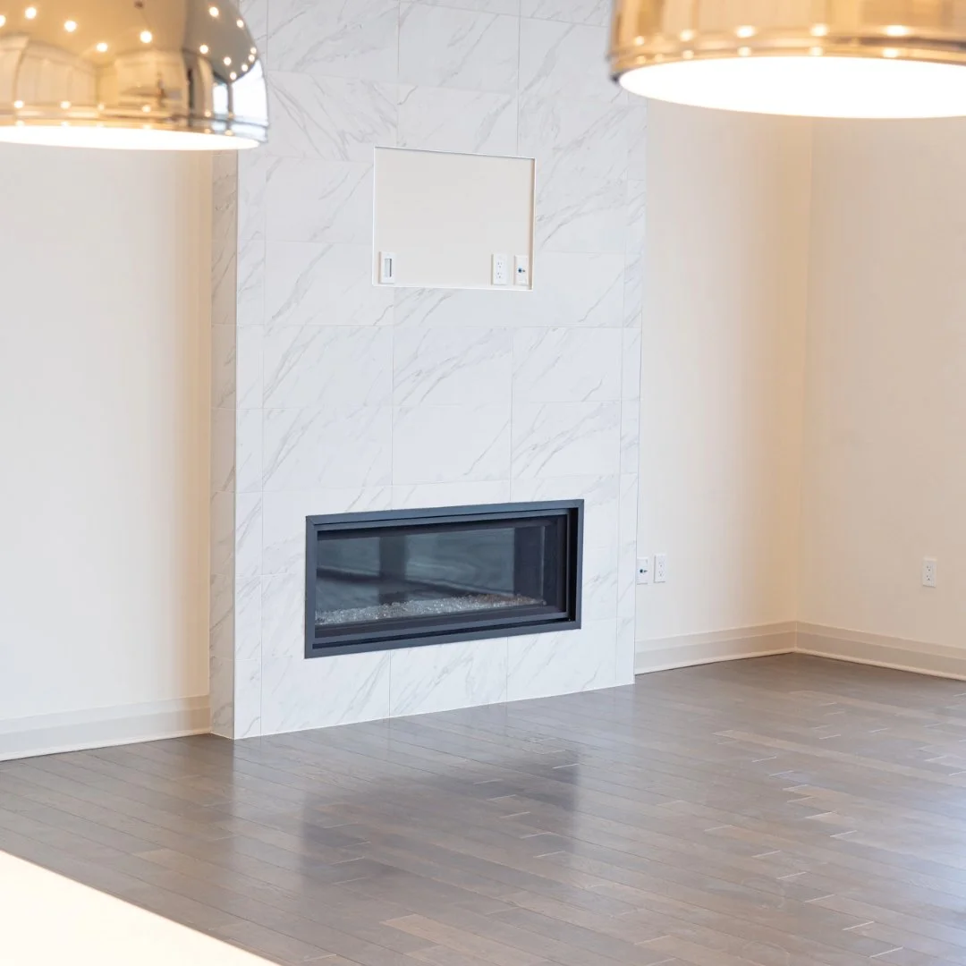 Effortless elegance in every corner 🖤✨ This living room boasts a marble-tiled accent wall with a modern gas fireplace and a built-in TV mount, making it the perfect focal point for upscale living.

📸 Let your space speak for itself. Contact me for 