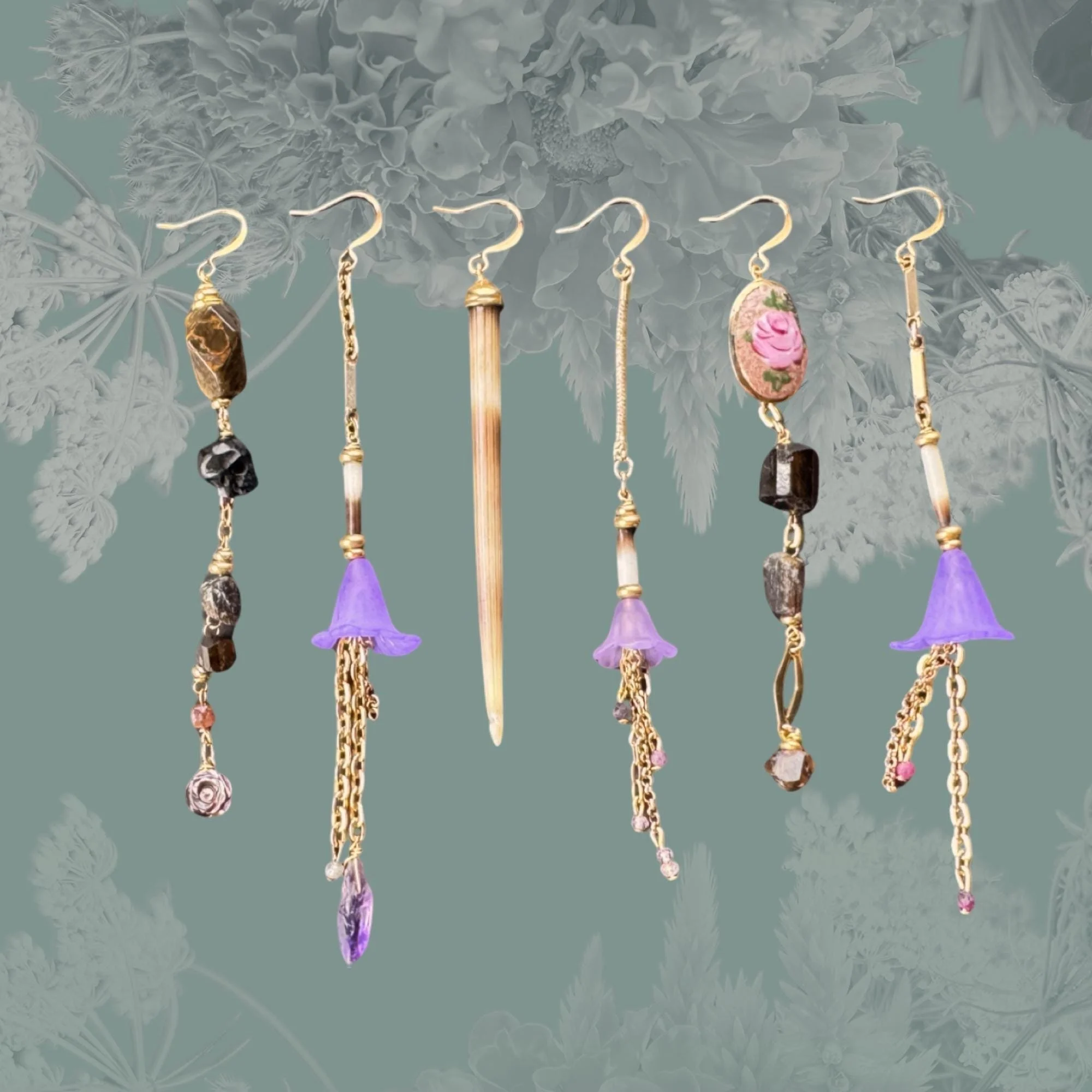 Assortment of ornate earrings with various designs and materials, including purple flowers, gemstones, and gold chains, against a floral-patterned green background.