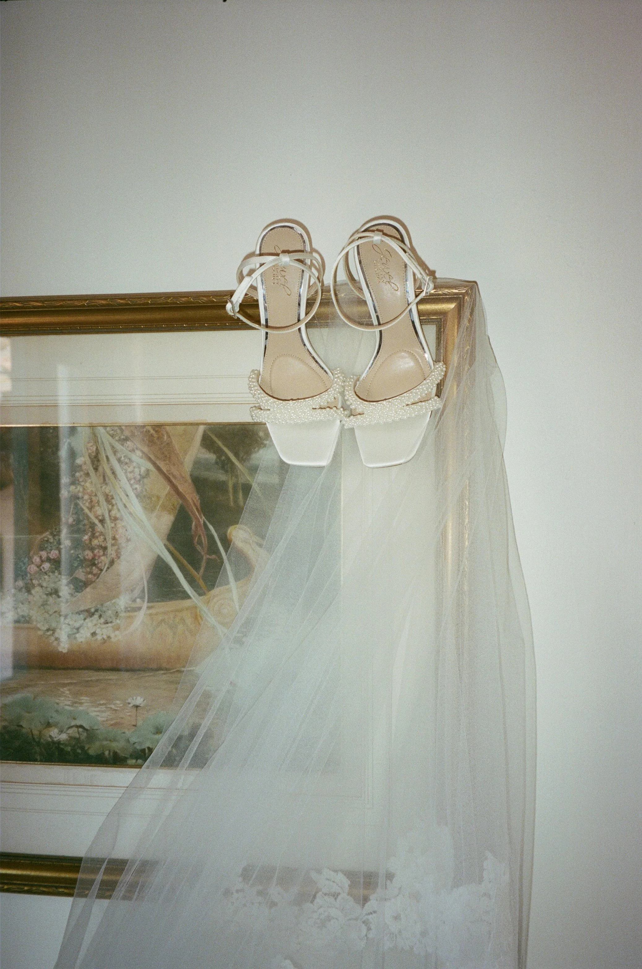 Bridal details including dress, shoes, and veil at Jeune Perché