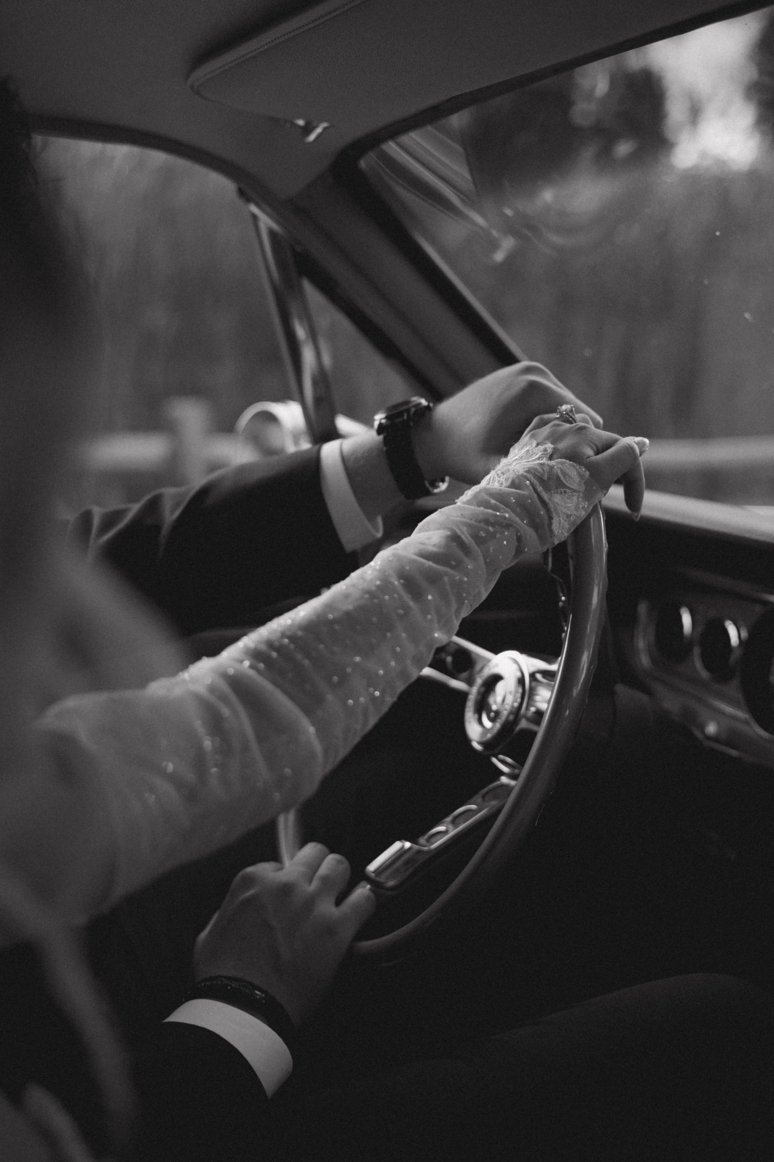 Wedding detail portrait of bride and grooms hands in vintage car at Lake Oak Meadows in Temecula