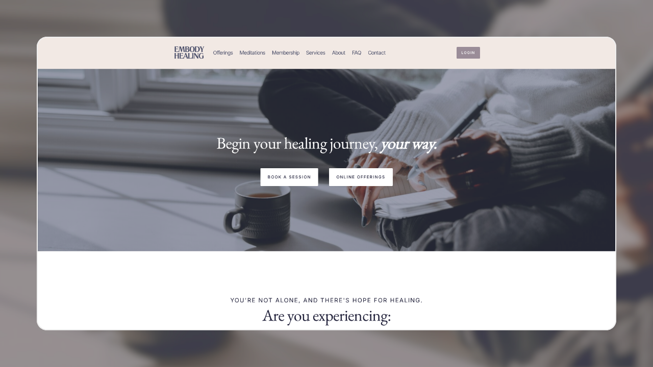 A webpage for Embody Healing with options to book a session or view online offerings. The header includes links to offerings, meditations, membership, services, about, FAQ, and contact. The main section has the message "Begin your healing journey, your way" and a background image of a person writing in a notebook near a window with a mug of coffee.