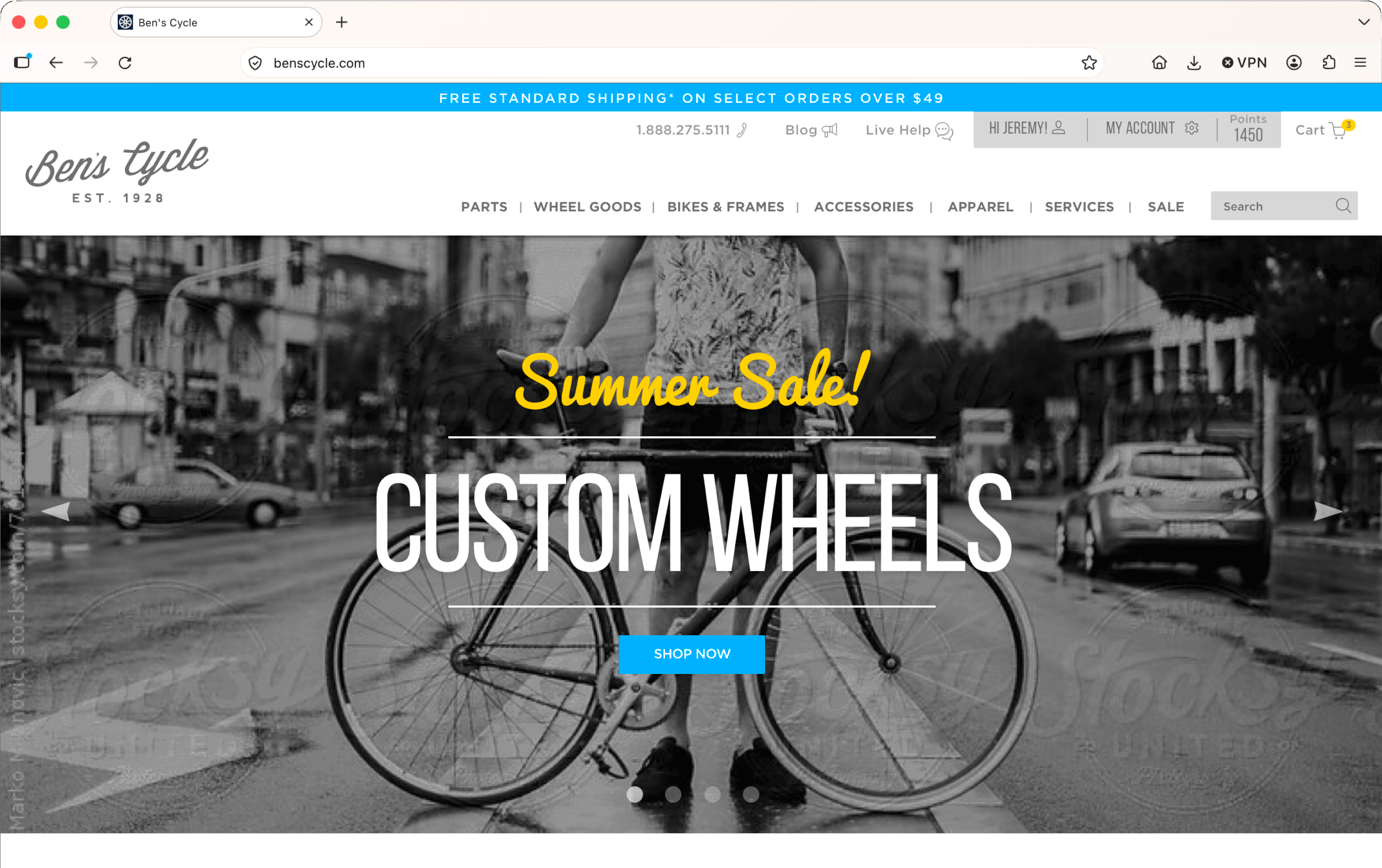 Homepage of Ben's Cycle website featuring a black and white image of a person with a bike, with the text 'Summer Sale! Custom Wheels' and a blue 'Shop Now' button.