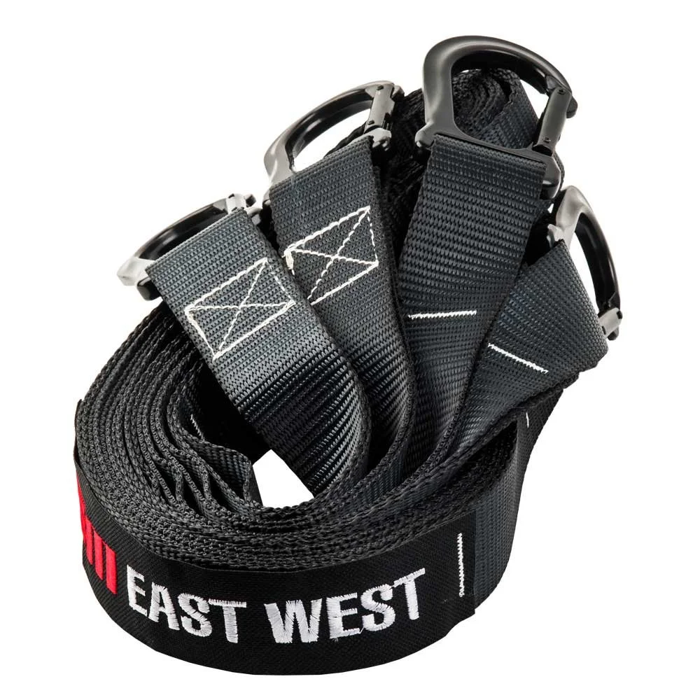 Coiled black tow strap with metal hooks and a tag that reads 'EAST WEST'