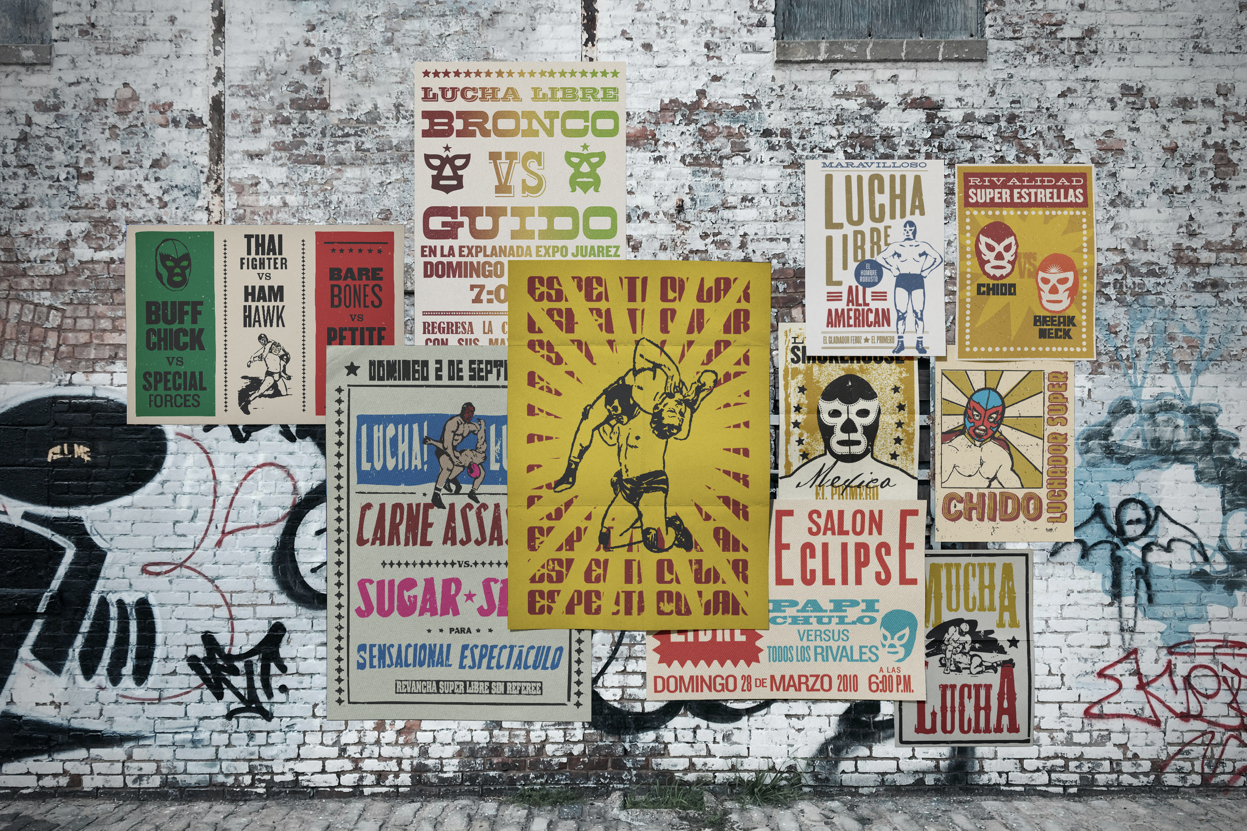 Posters for a lucha libre wrestling event posted on a brick wall, featuring stylized images and text in Spanish about various matches and wrestlers.