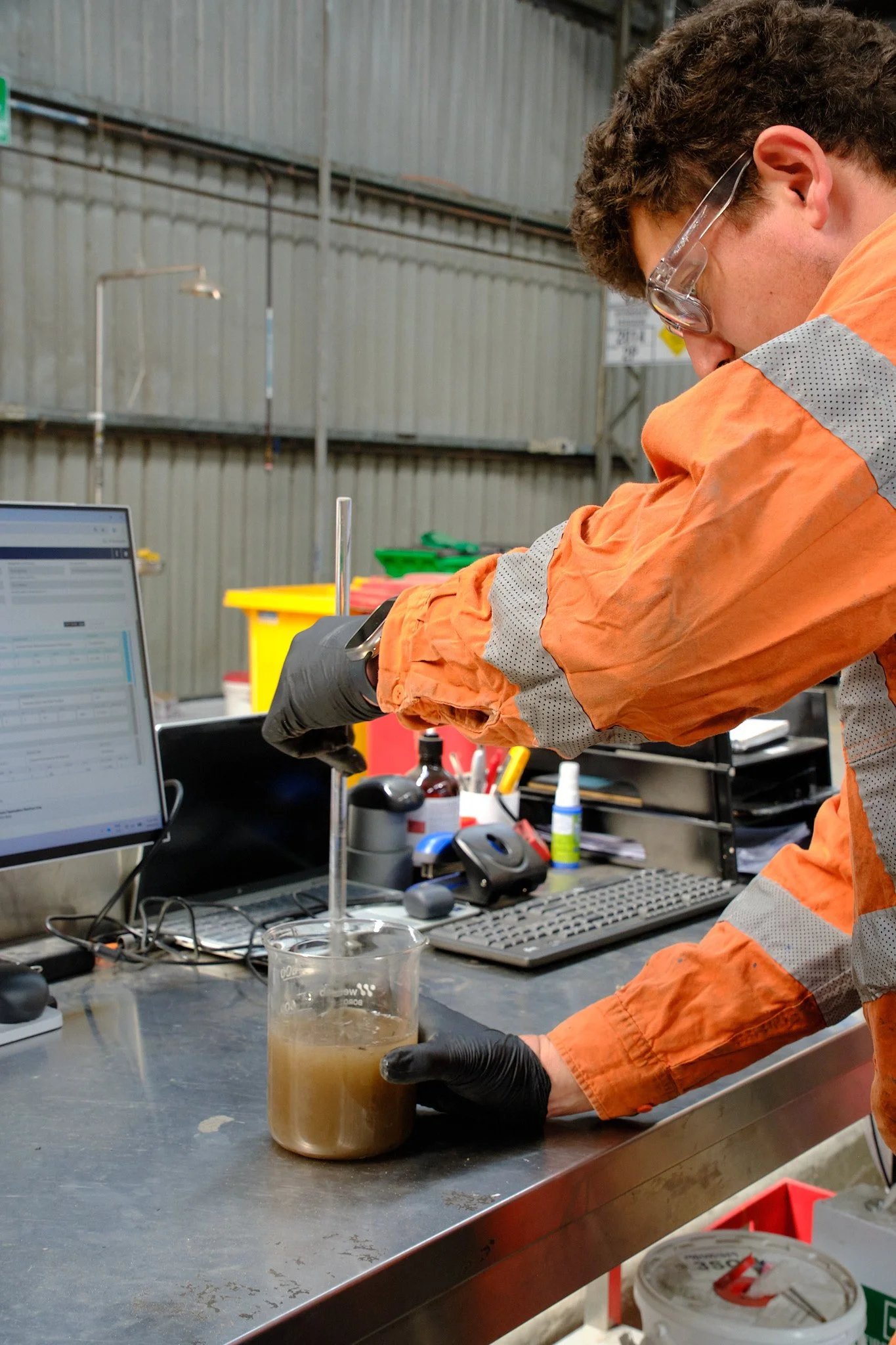 CleanEra chemist assessing unidentified chemical waste