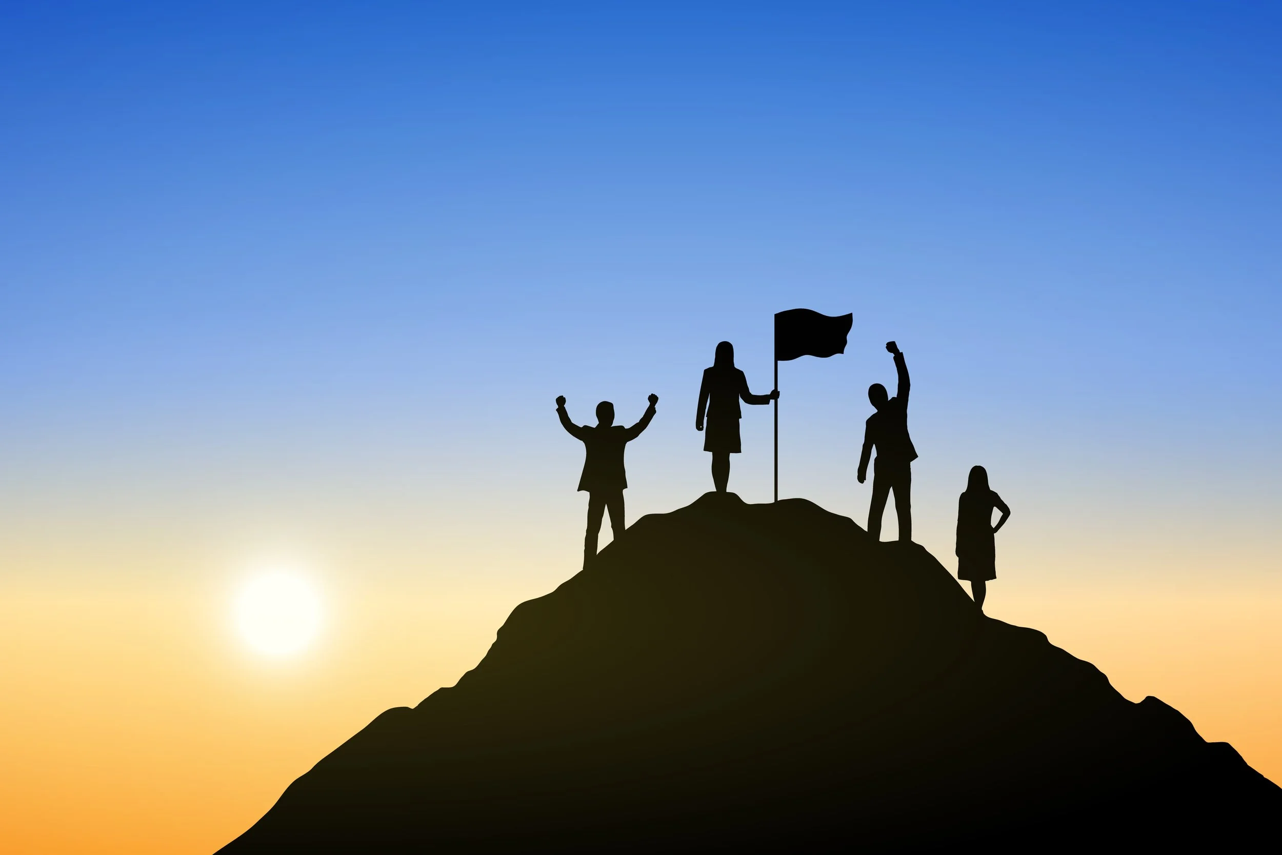 groupe d'individus au sommet d'une montagne