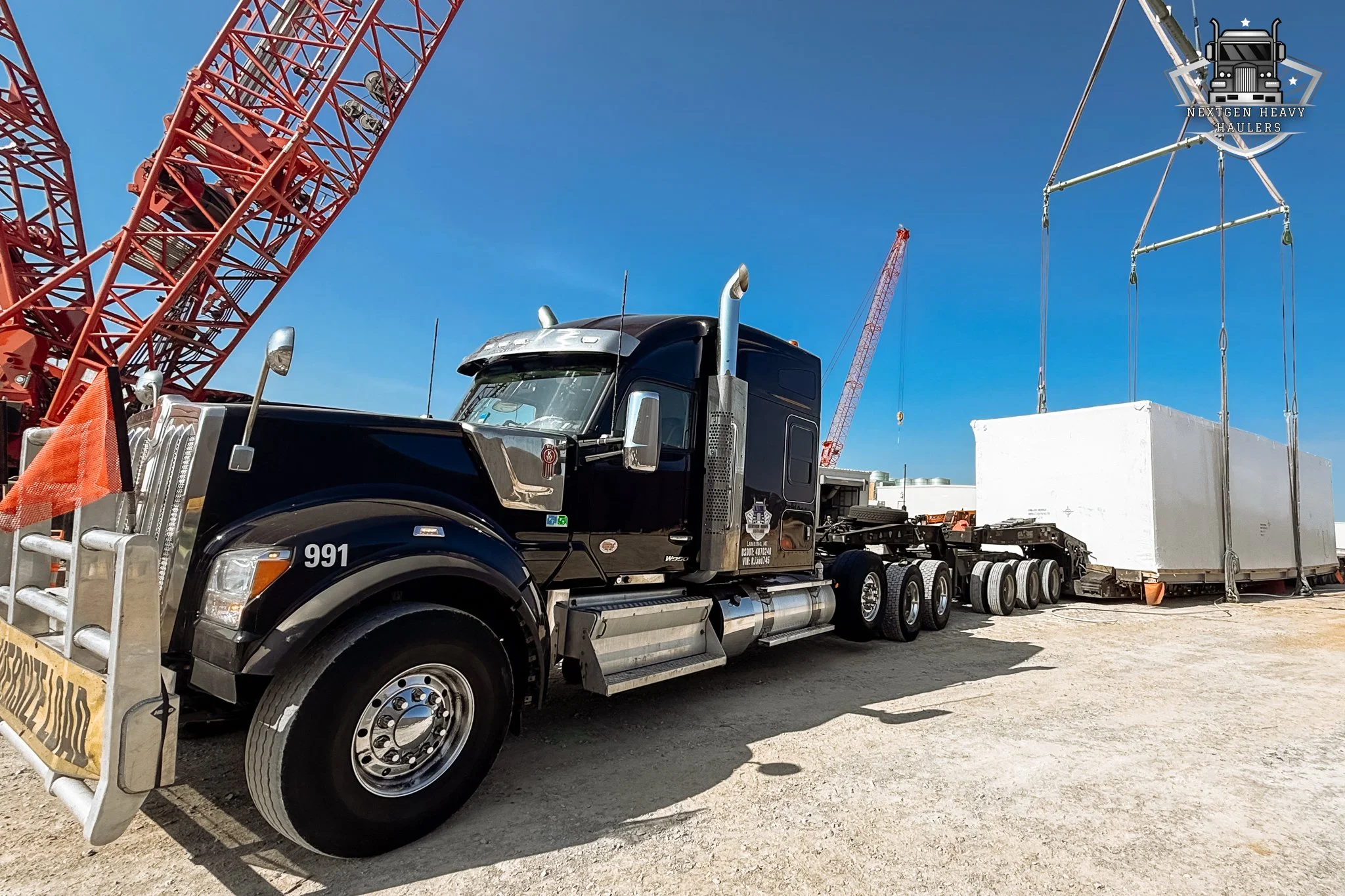 Our team handled this oversized, custom-crated unit with the coordination and care it demands.
From crane lift to securement &mdash; every detail matters when moving freight of this scale.