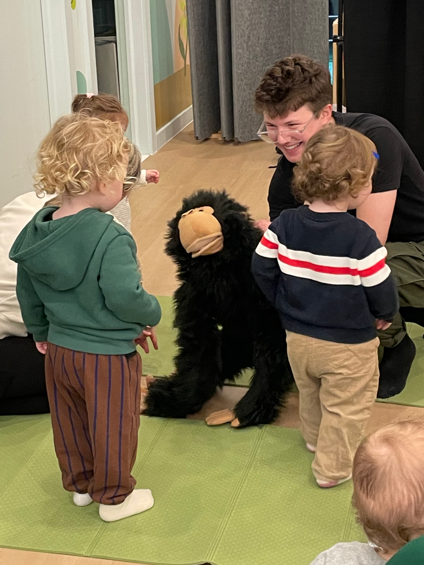 A group of young children attending a class at Chelsea Forest Play, an indoor playground in NYC.