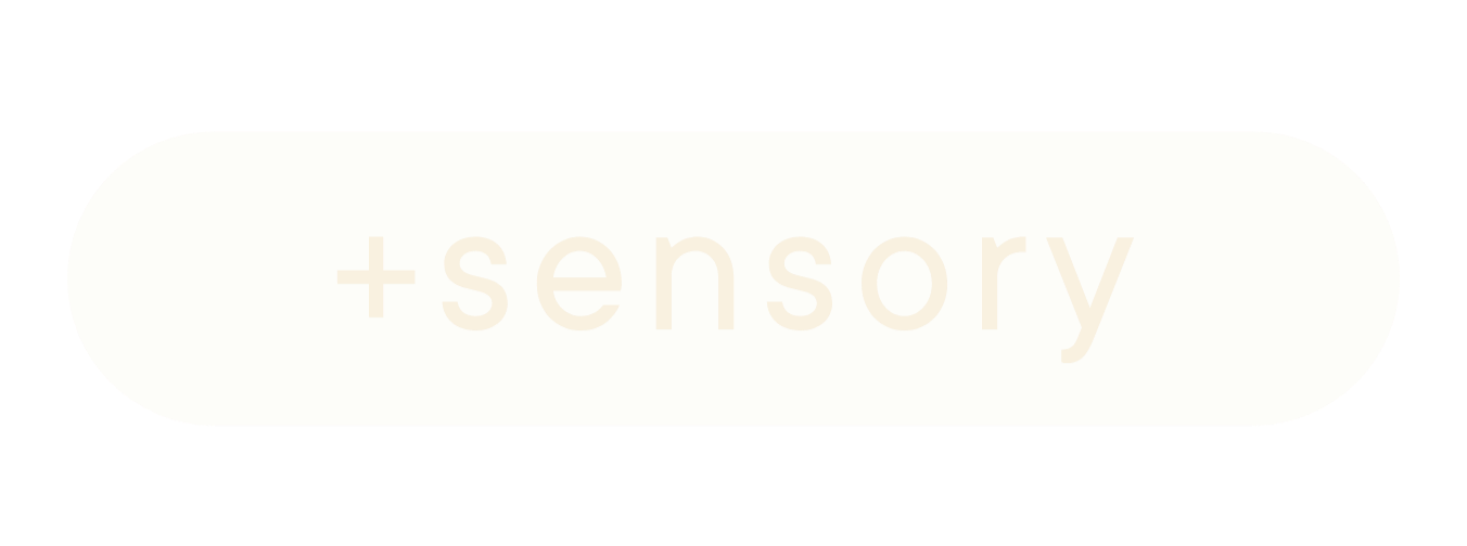 elongated button with rounded ends and a faint shadow behind it, it reads "sensory"