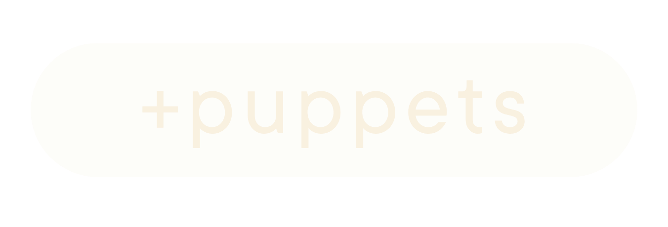 A beige rounded rectangle with the word 'puppets' written faintly in the center.