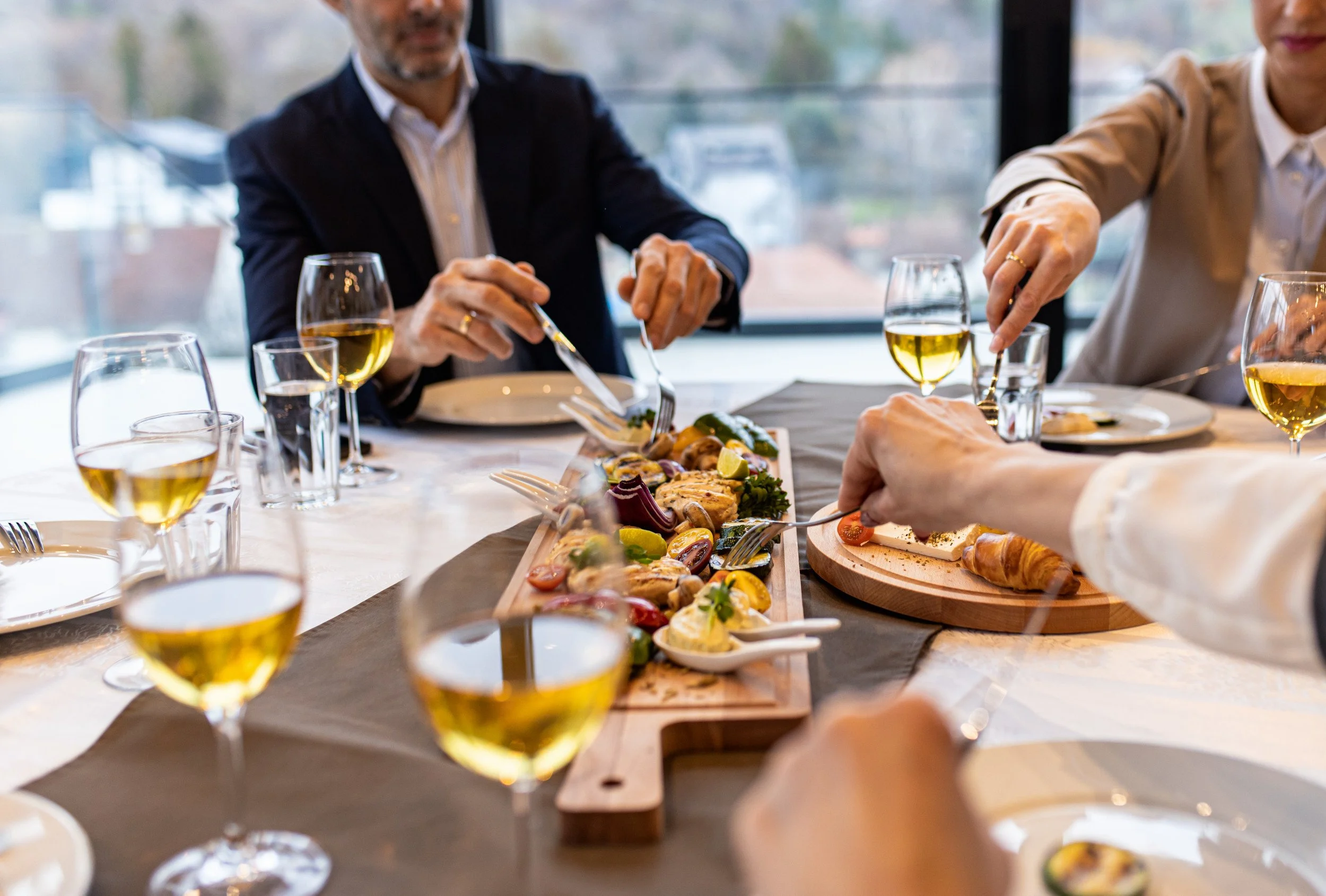 close-up-of-peoples-hands-in-restaurant-taking-mea-2026-03-26-23-27-10-utc.jpg