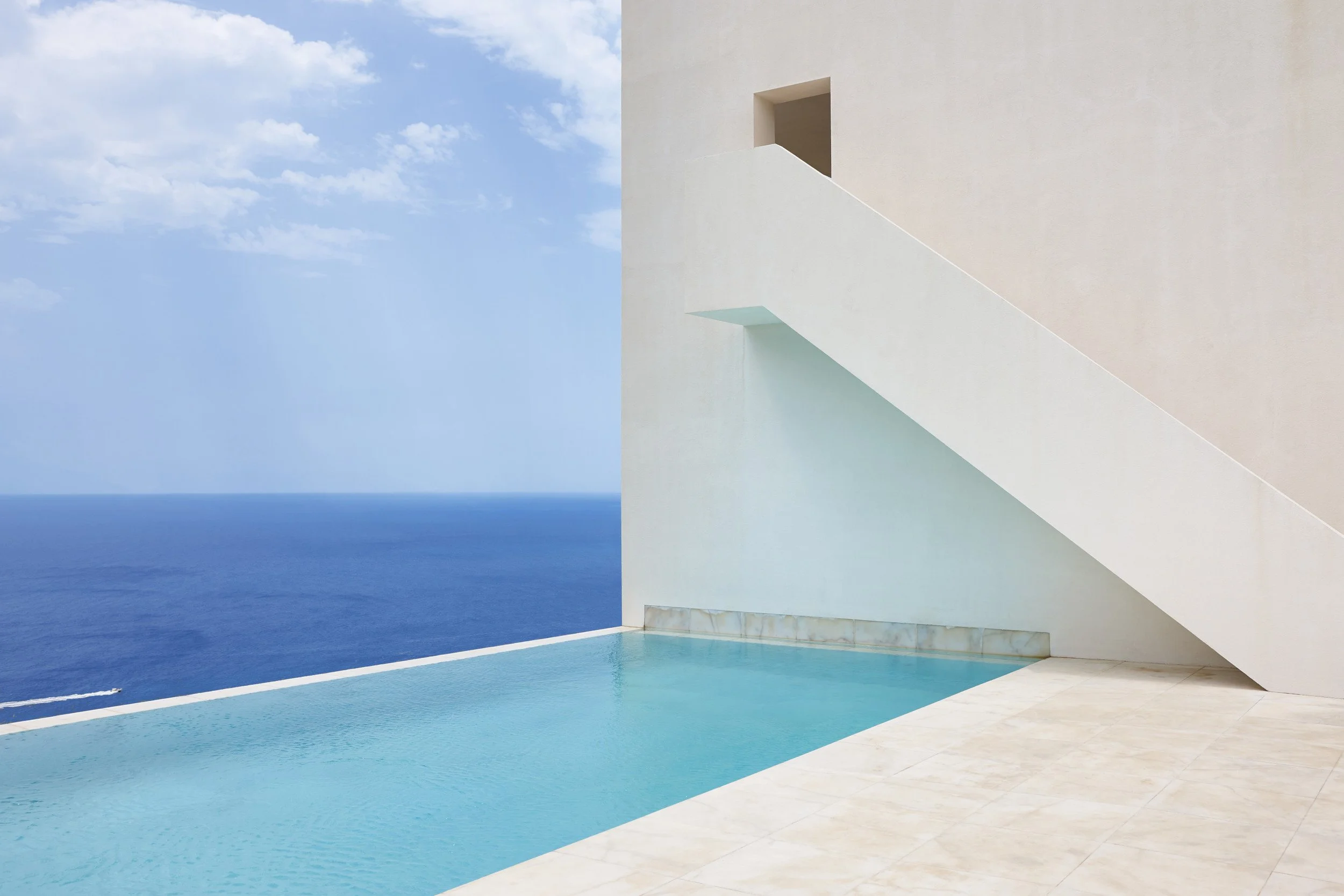 white-geometric-building-facade-in-spanish-coastli-2026-03-17-21-33-40-utc.jpg