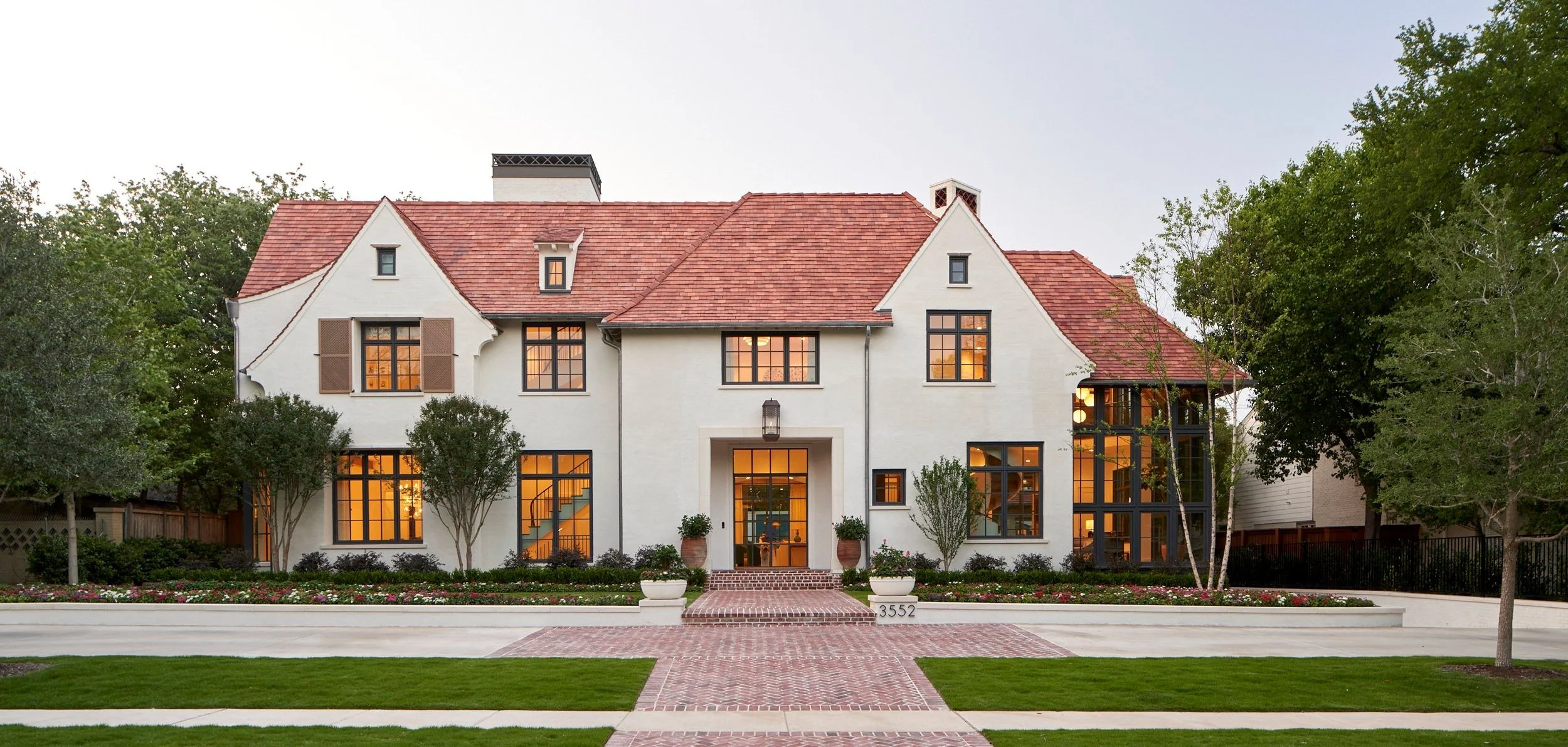 Marquette Residence, front elevation at dusk