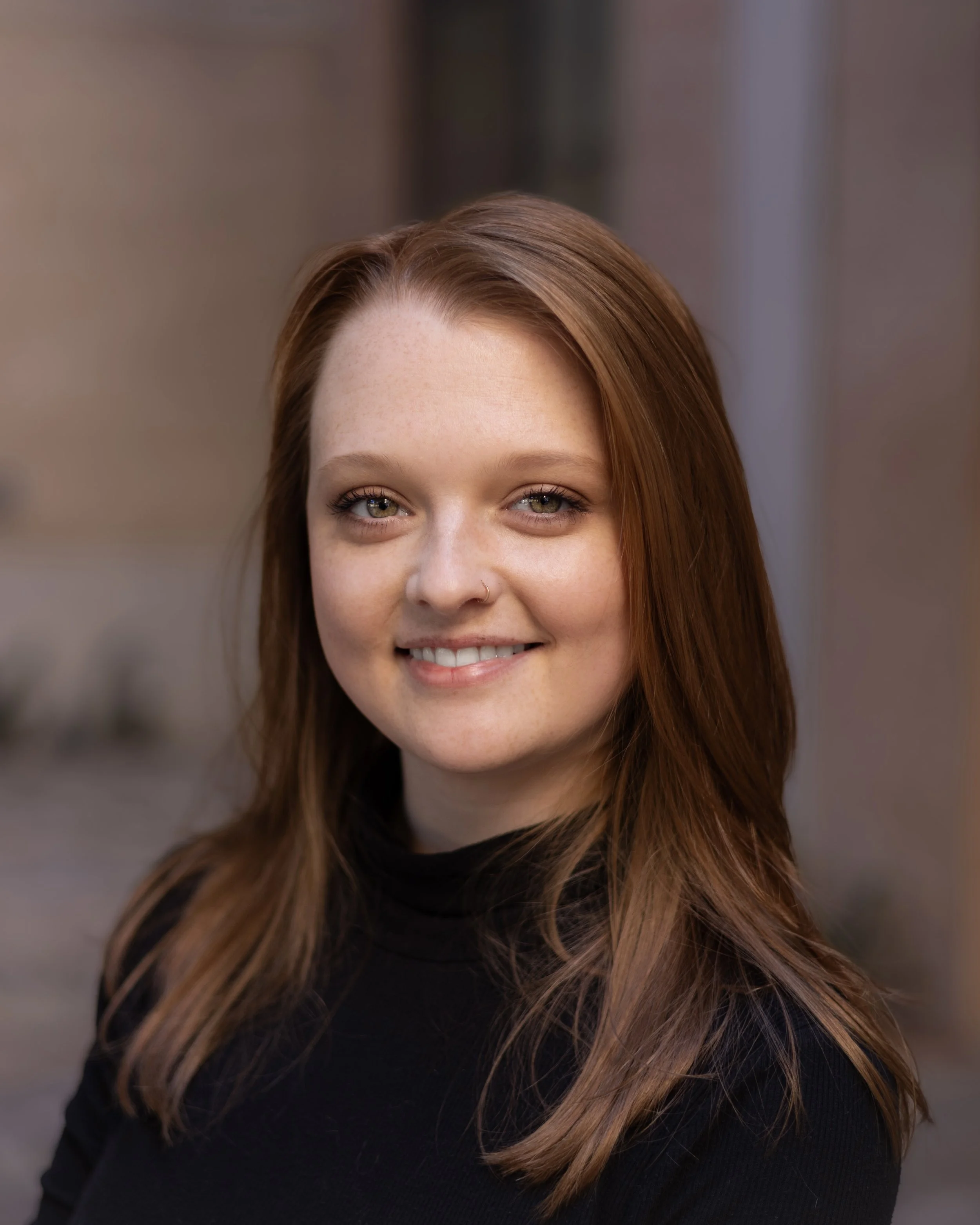Headshot of Licensed Professional Counselor, Brooke Albrecht, a young woman with red hair and happy, smiling features, located in New Braunfels, Texas at Living Tree Counseling Center
