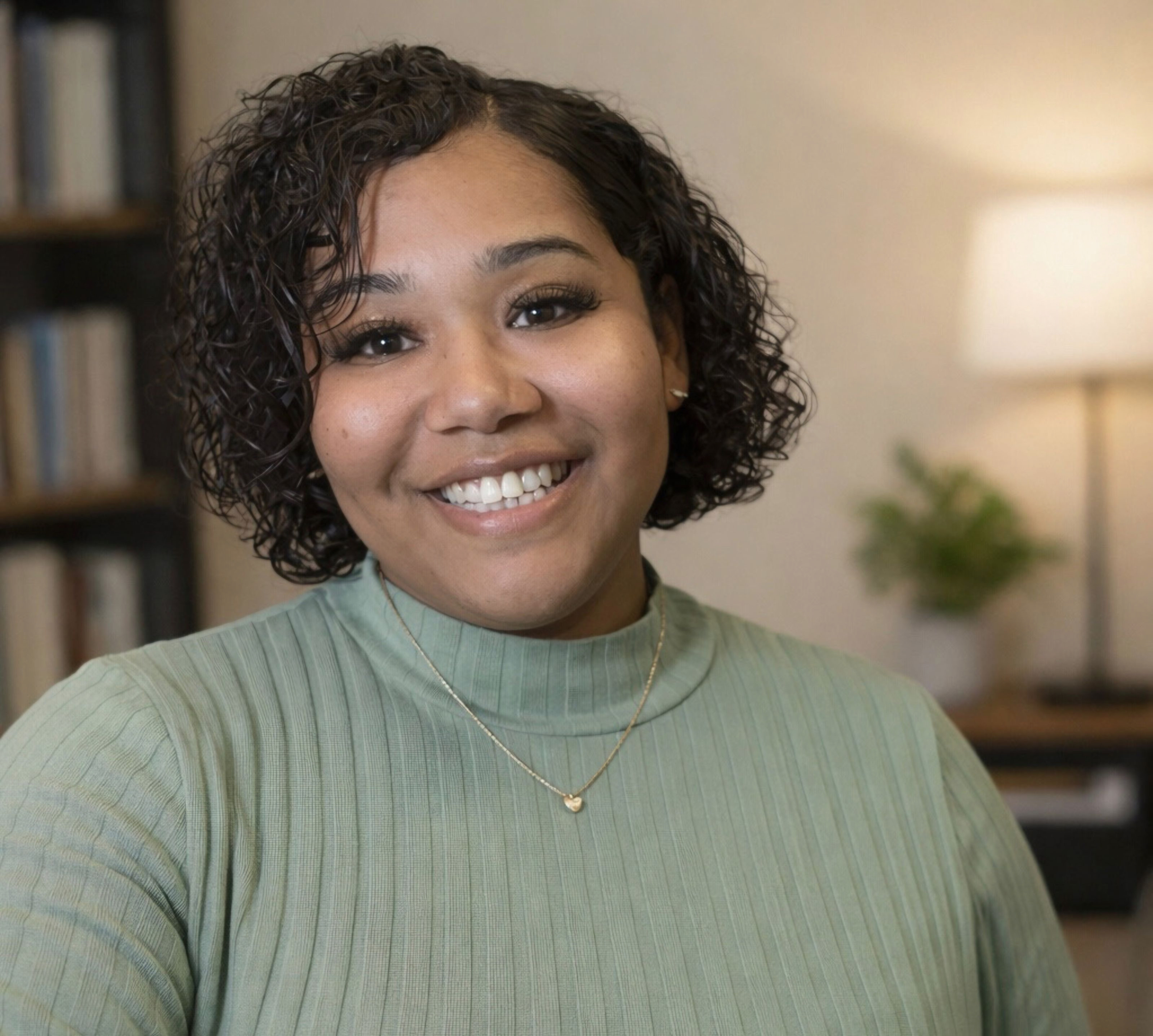 Headshot of a young African American woman, Deedra Hayes, a licensed professional counselor associate with Living Tree Counseling Center.