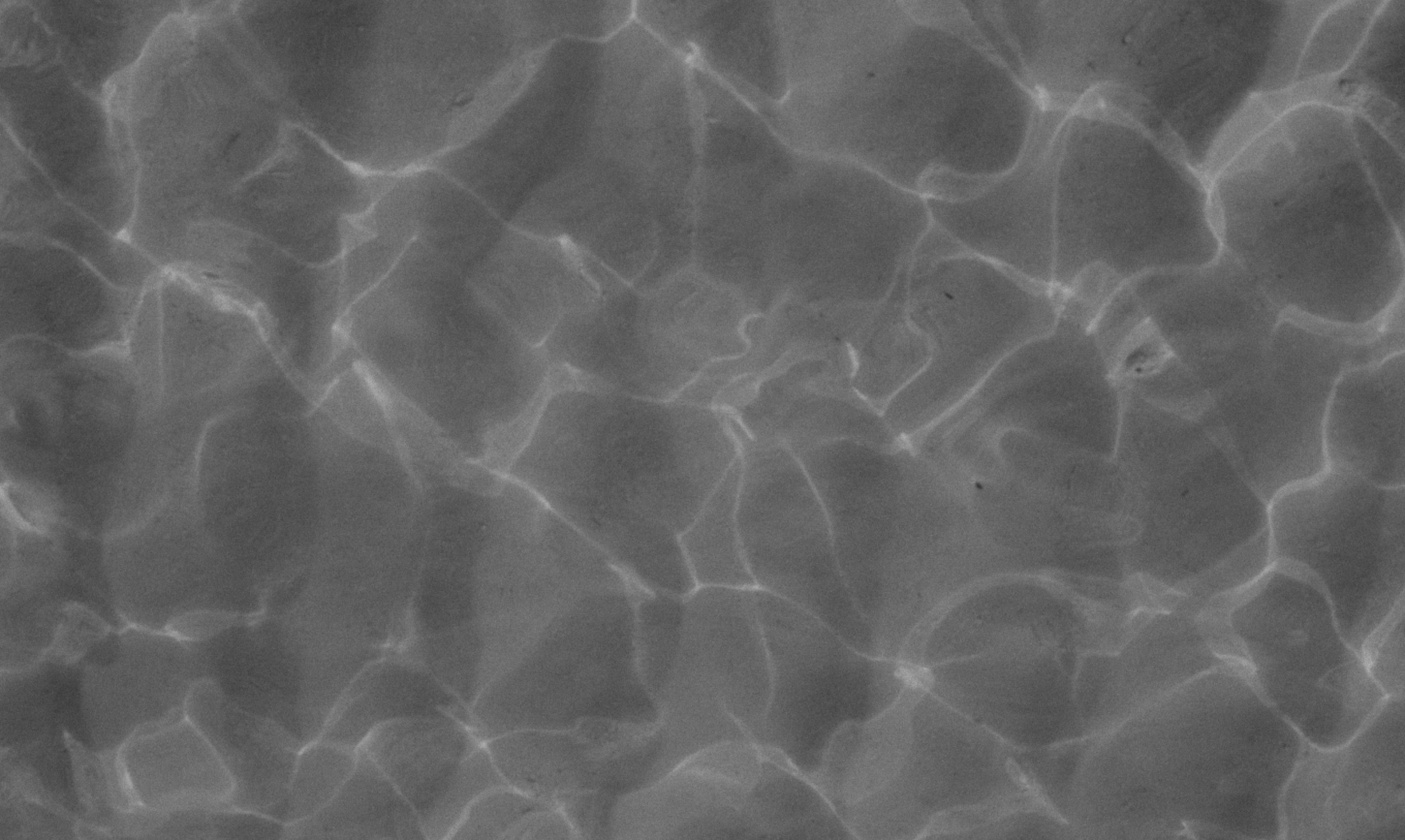 Black and white ocean surface with gentle light reflections, representing space and freedom in freelance work.