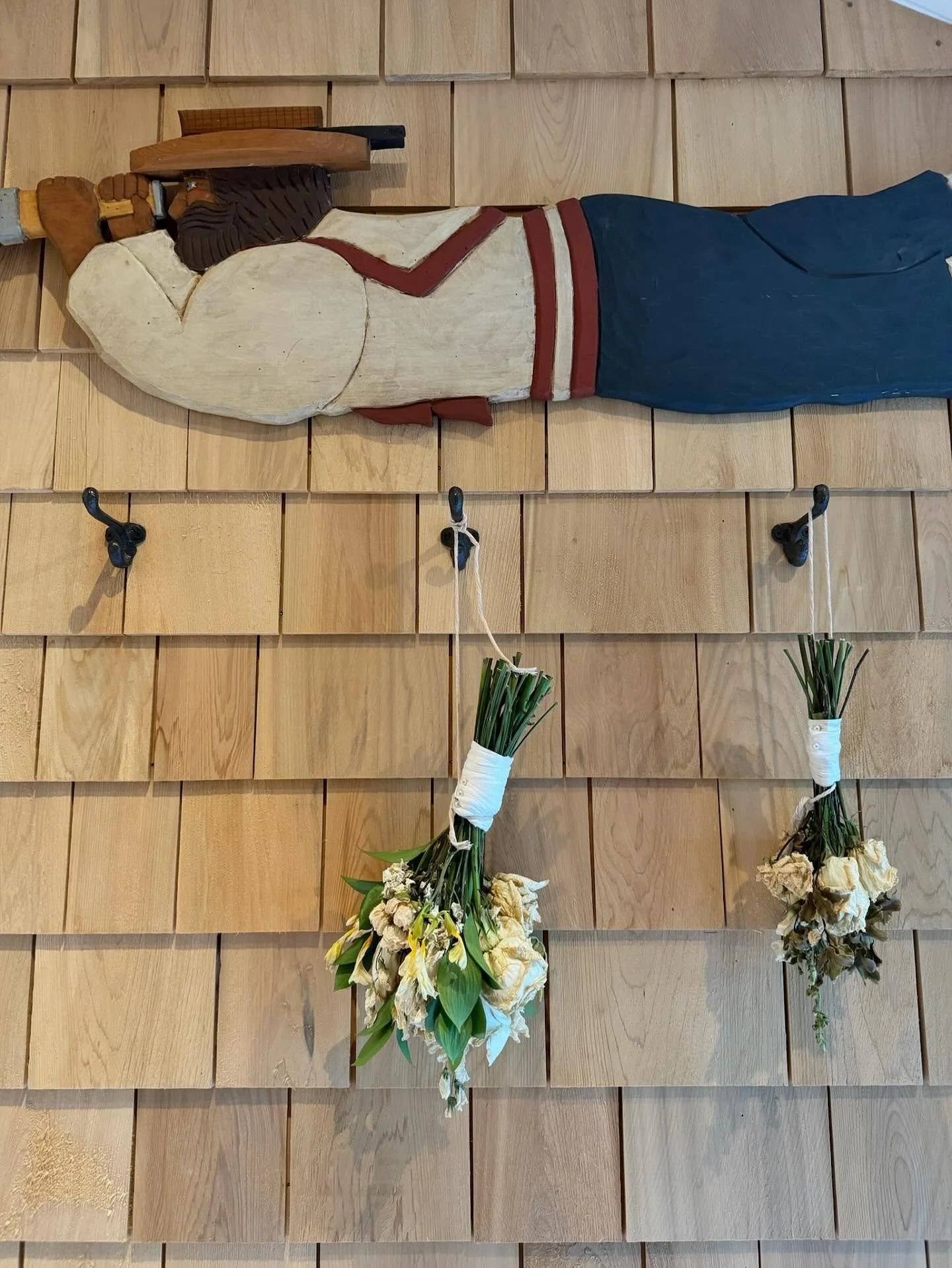 One of our favorite ways to hang onto summer is with dried florals that can last through the colder months. At the Main St house we just hang our arrangements on coat hooks in the mudroom and let our trusty antique sailor keep watch over them until t