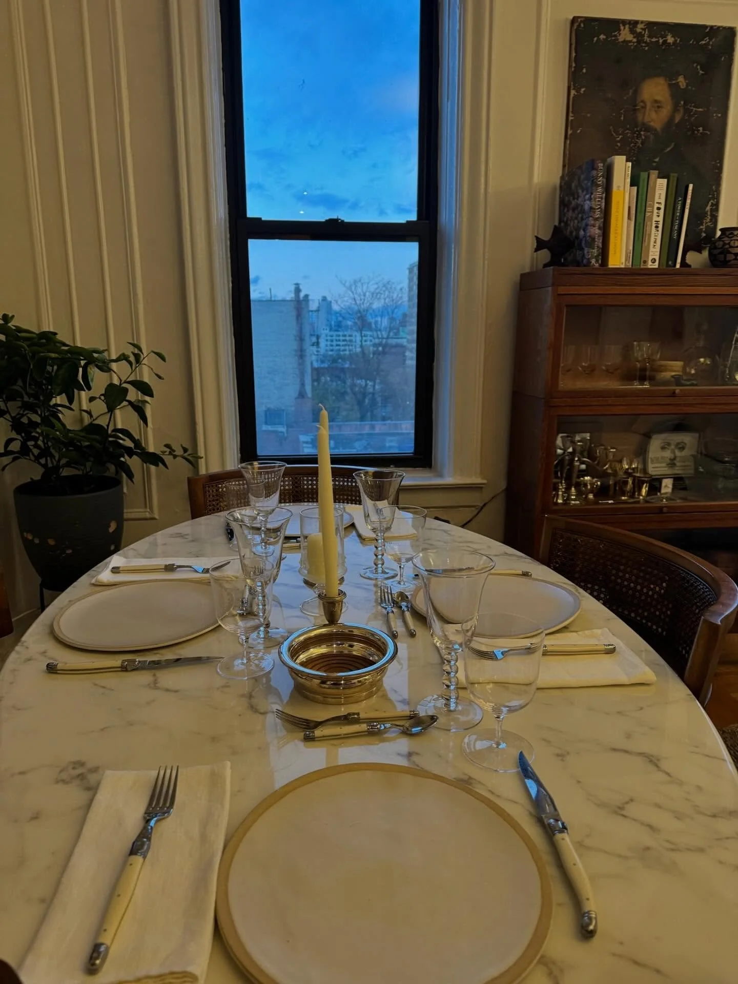 Dinner parties are possible even in tight spaces. Because our apartment is small, I try to make my pieces multitask &mdash; from a work table to a dining table, etc. These vintage chairs my mom found years ago curve and tuck perfectly under the table