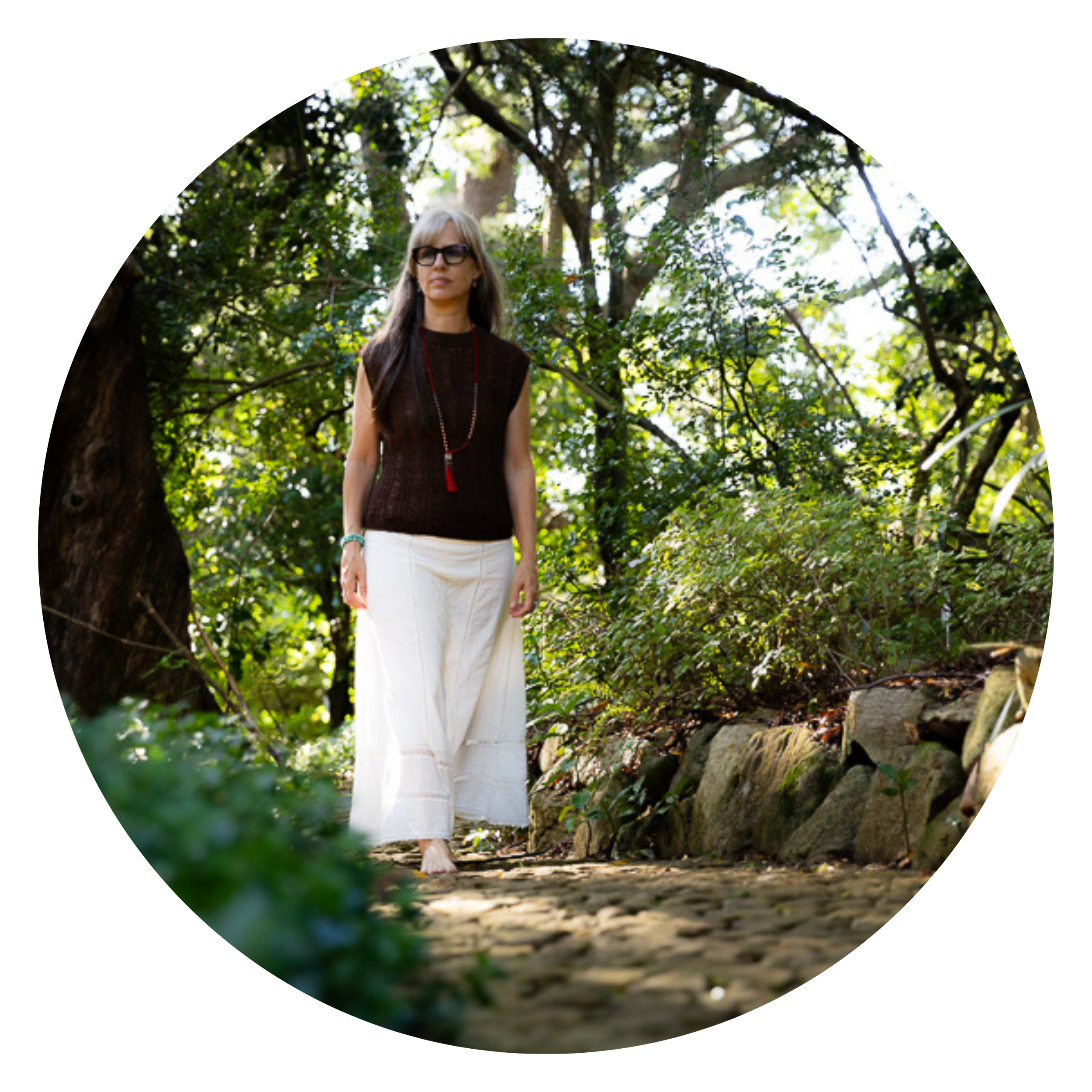 Alrina Laker, founder of Sacred Ember, standing in a forest representing the path of shamanic healing and inner transformation