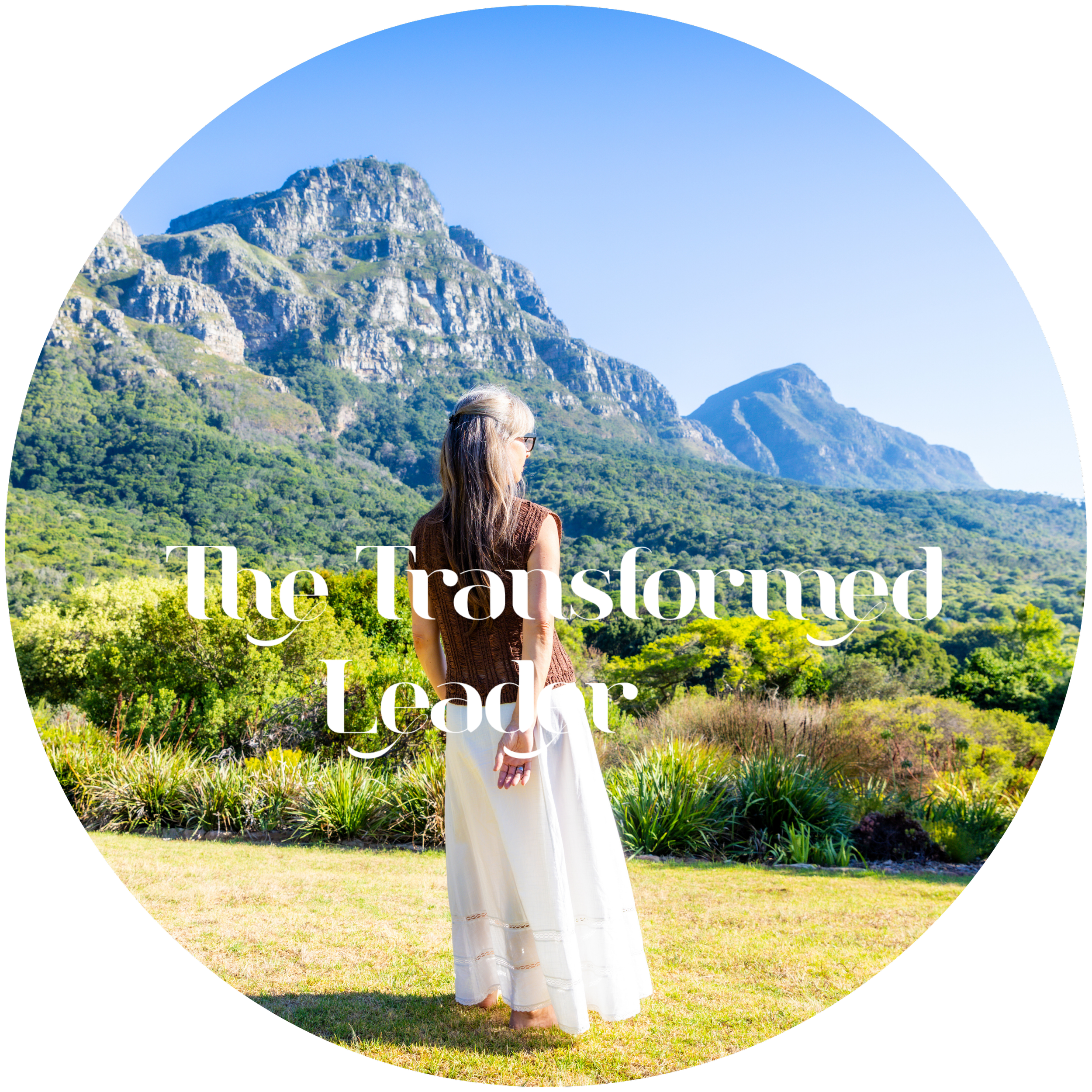 Alrina Laker standing before a mountain landscape in Cape Town, click to explore The Transformed Leader shamanic leadership transformation journey