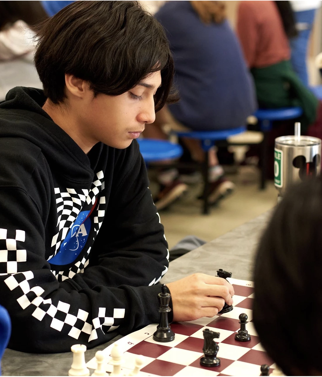 Teenage boy playing chess