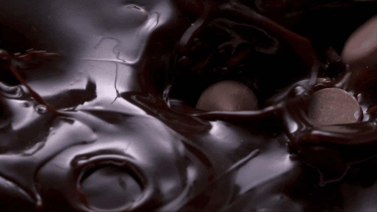 Close-up of dark melted chocolate with three chocolate balls inside. Chicago Milwaukee Midwest Illinois Food Food beverage Food Drink Savory Photographers photographer photography videography videographer CPG Bennett Fuhrman Ben Tiny Scheme