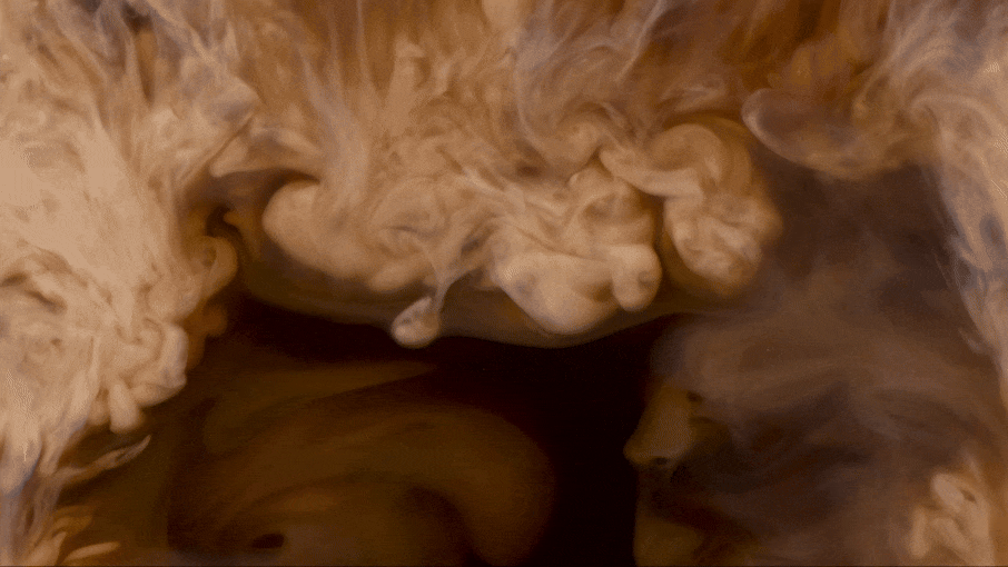 Dark swirling liquid with light-colored smoke or ink swirling on top. Chicago Milwaukee Midwest Illinois Food Food beverage Food Drink Savory Photographers photographer photography videography videographer CPG Bennett Fuhrman Ben Tiny Scheme