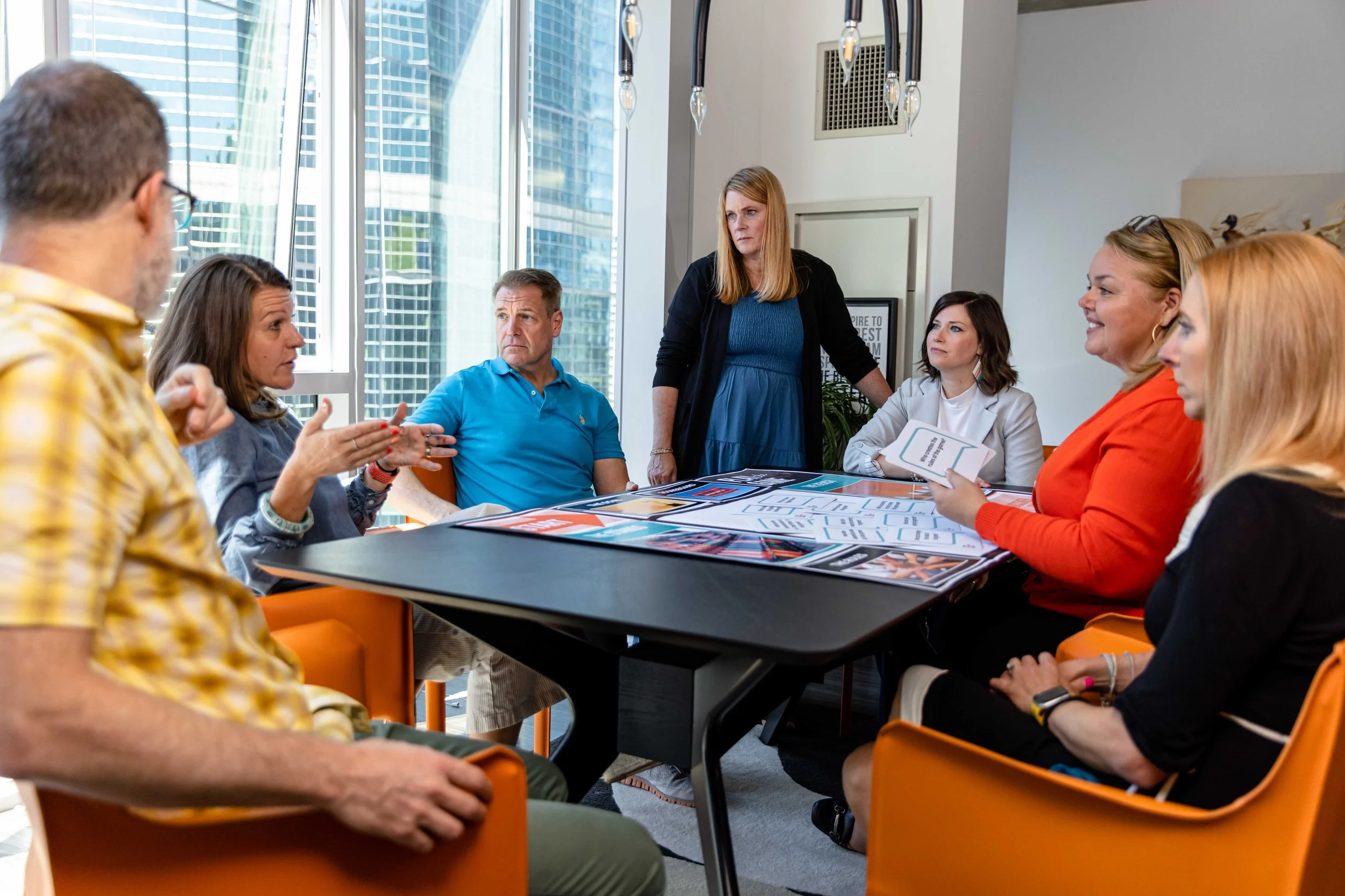 Group of individuals engaging in in-person leadership training.