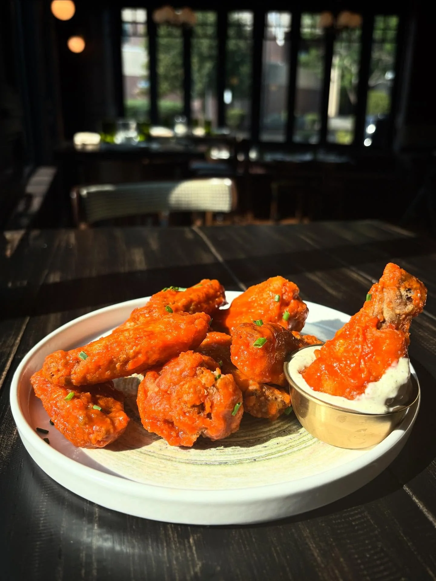 The Perfect Sunday Bite: Our Twice Fried Buffalo Wings 

The ultimate duo of heat and crunch, served with our house-made poblano ranch for the perfect cool finish