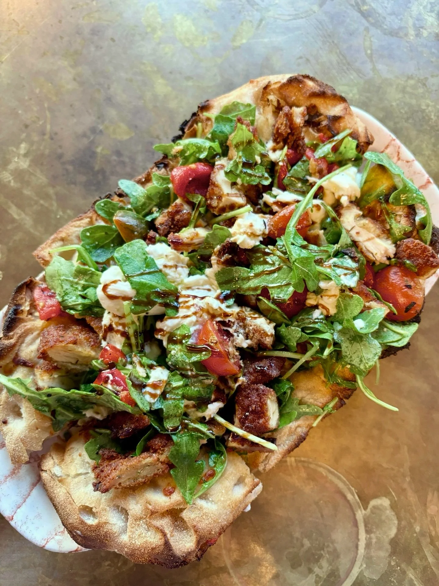 What&rsquo;s happening this week at 10 Lowell!? Come check out all the fun&mdash;we can&rsquo;t wait to see you!  Pictured special: Chicken Cutlet Flatbread | Crispy chicken cutlet, arugula, tomato, roasted peppers, and burrata, finished with a balsa
