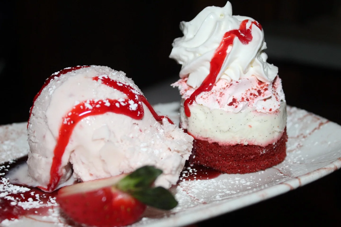 Take a bite of something sweet
Our red velvet cake served with strawberry gelato is calling your name - open daily at 11 am!