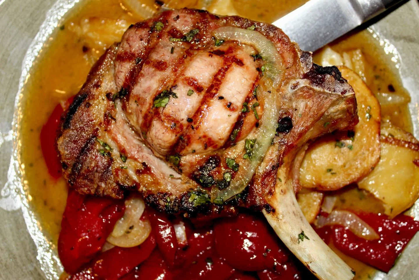 Perfectly grilled pork chop paired with roasted potatoes, sweet onions, and bright vinegar peppers for the perfect balance of rich and tangy

On the special board this weekend - come visit us!