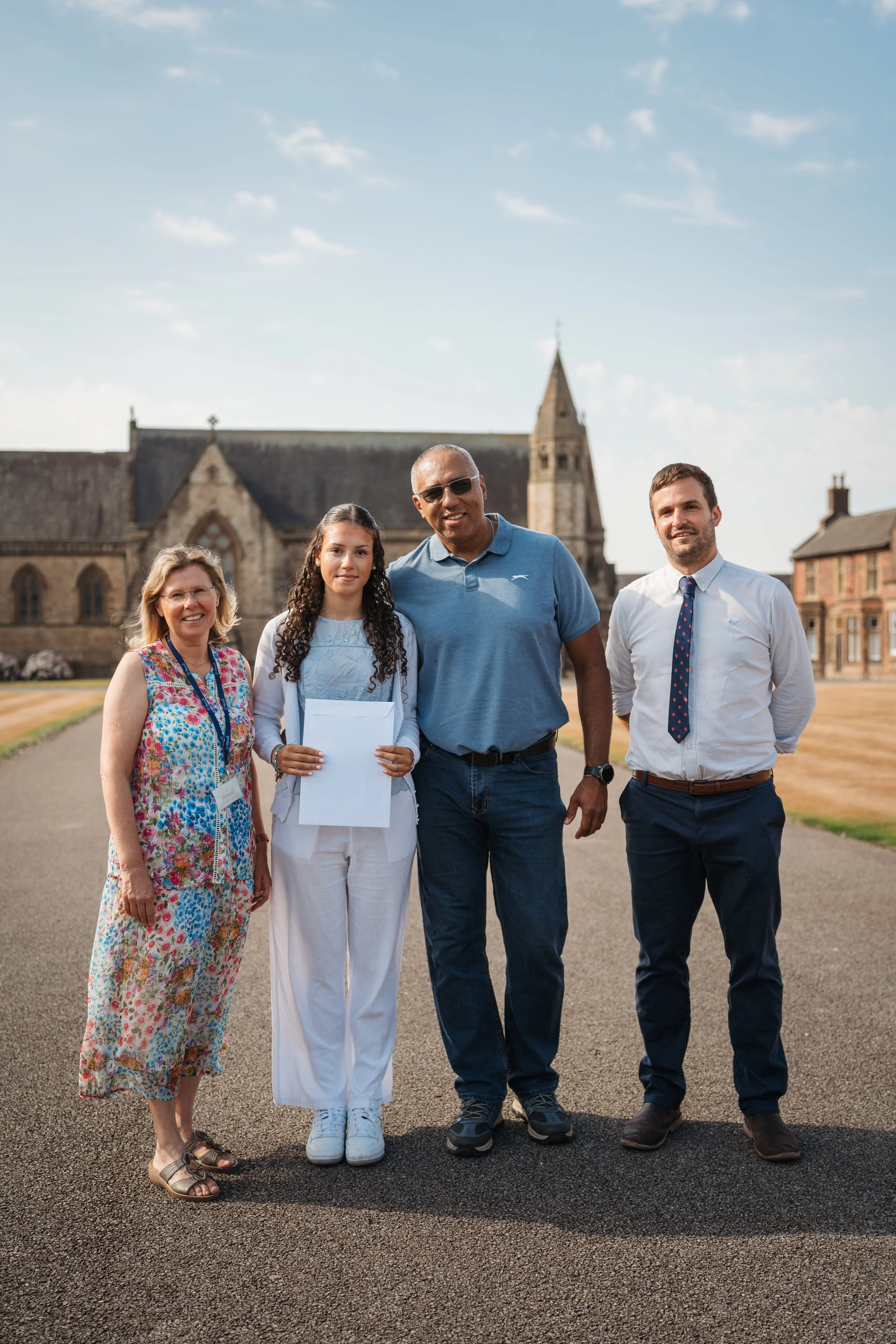 Yesenia with her proud parents and Nick Crombie, Director of Sixth Form (1).jpg