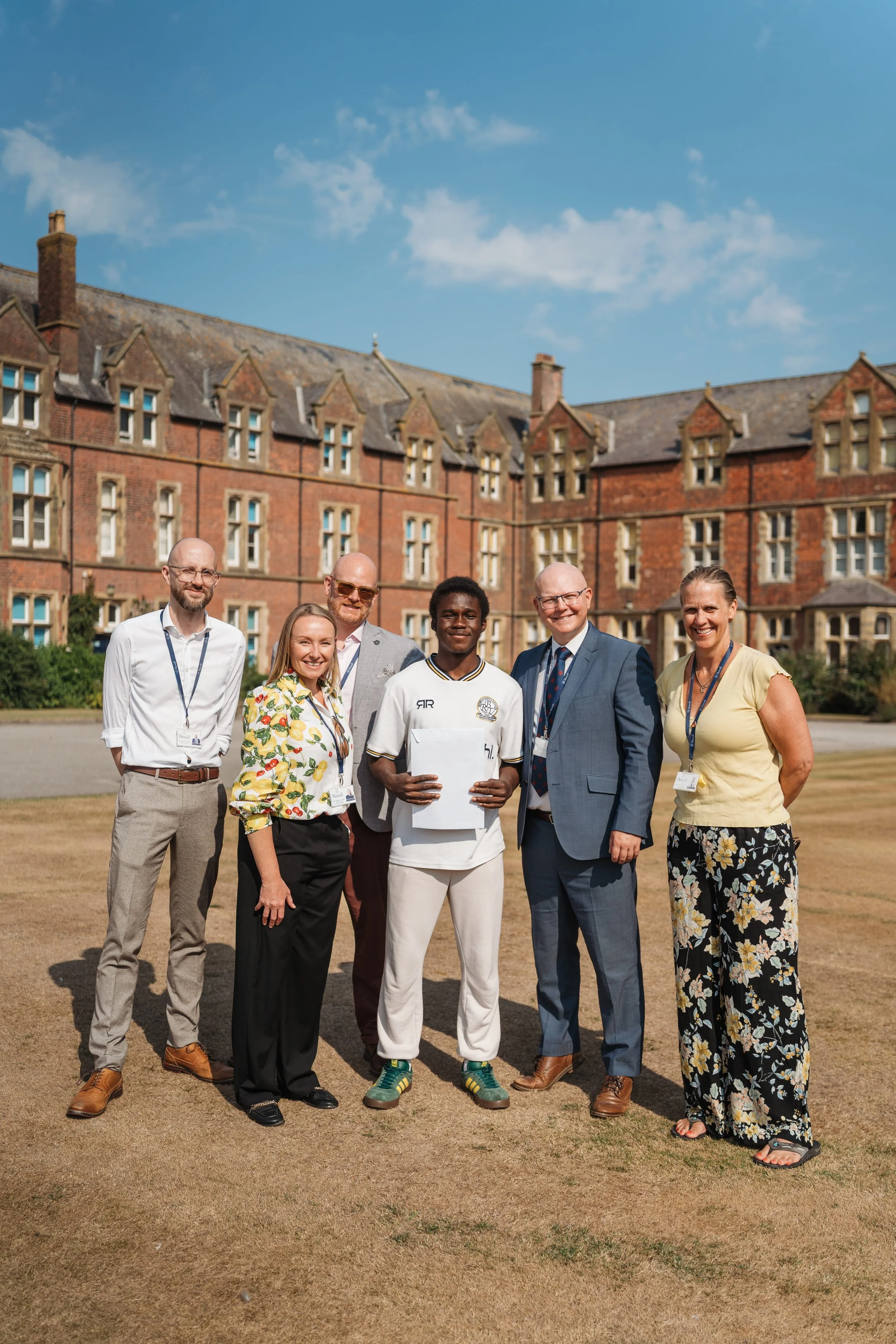 Loïc celebrates his triple distinction Sport BTEC with Rossall teaching staff