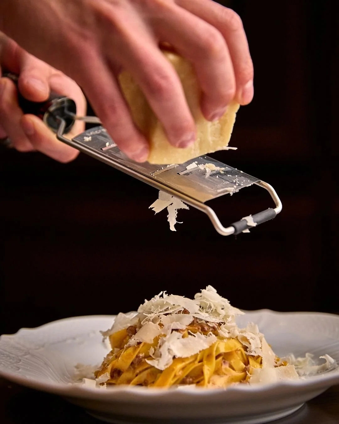 Our tagliatelle bolognese is topped with shaved parmesan and sprinkled with Sicilian oregano before meeting you at the table.