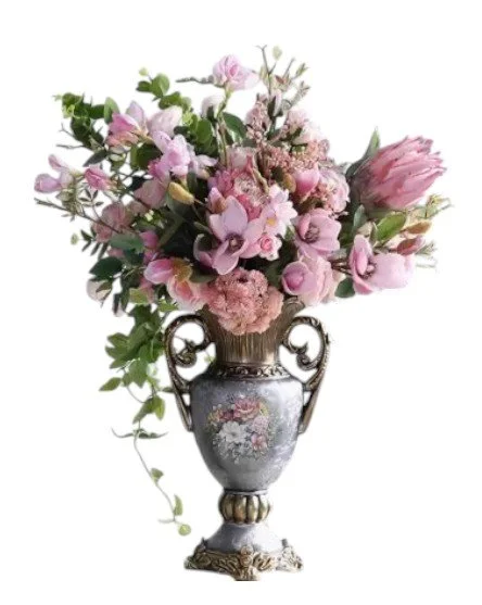 A decorative vase filled with pink and purple flowers, including roses and tulips, on a white background.