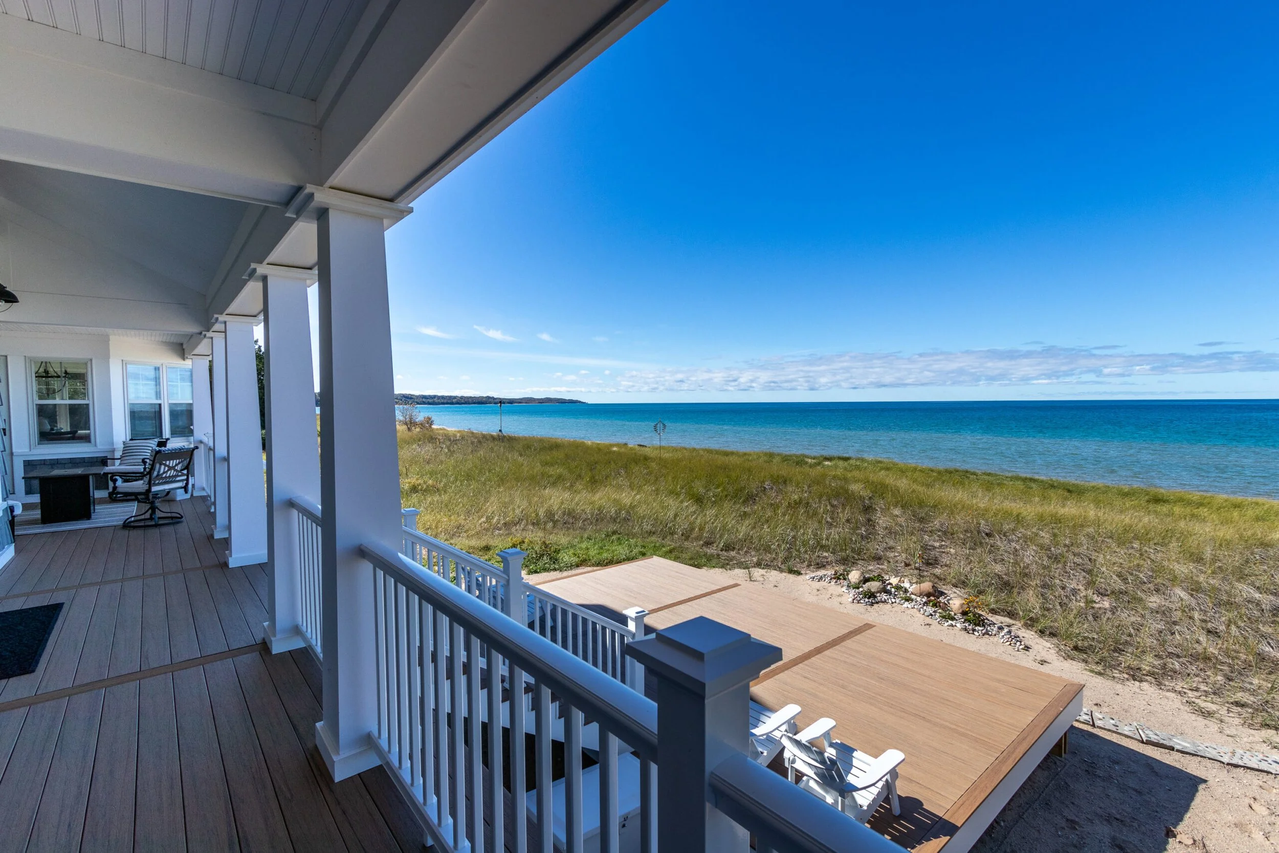 Craftmark Construction Home Remodel with new porch and deck and view of Lake Michigan
