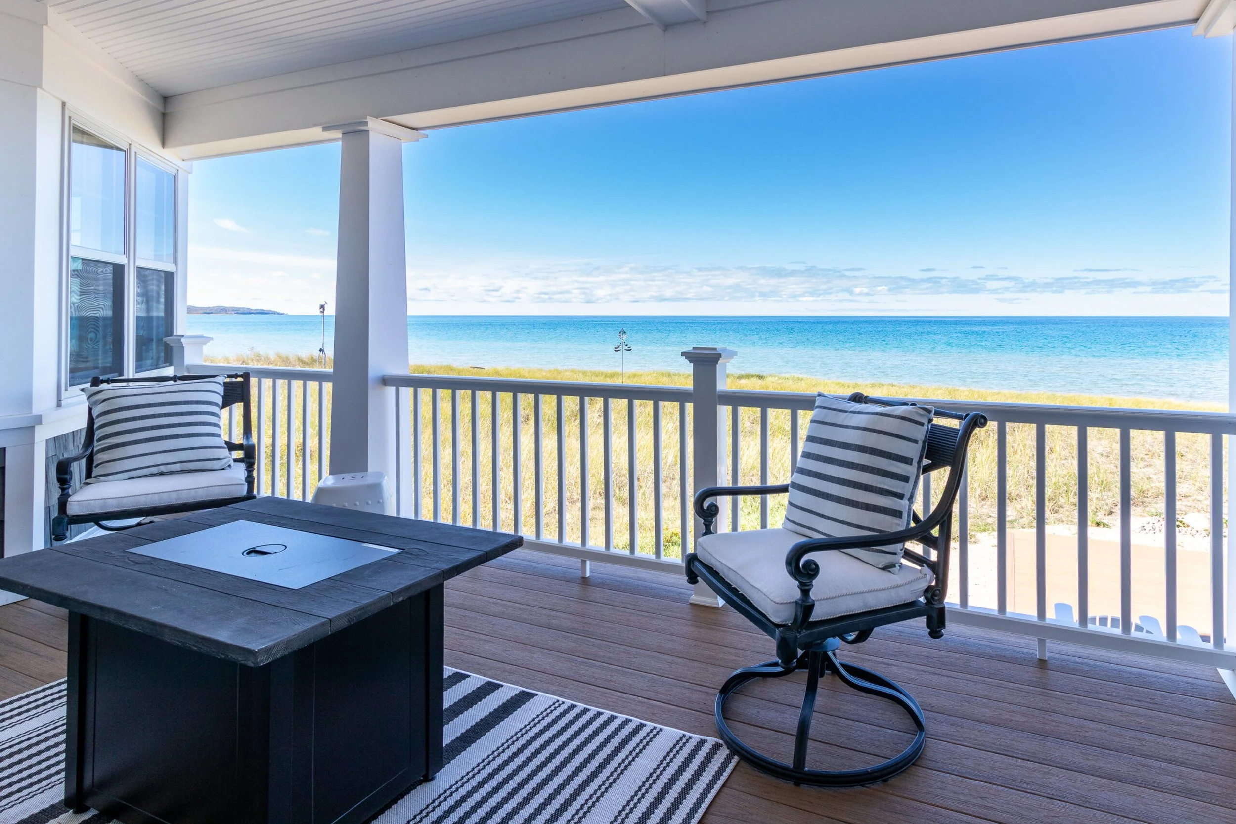 Craftmark Construction custom home porch with view of Lake Michigan