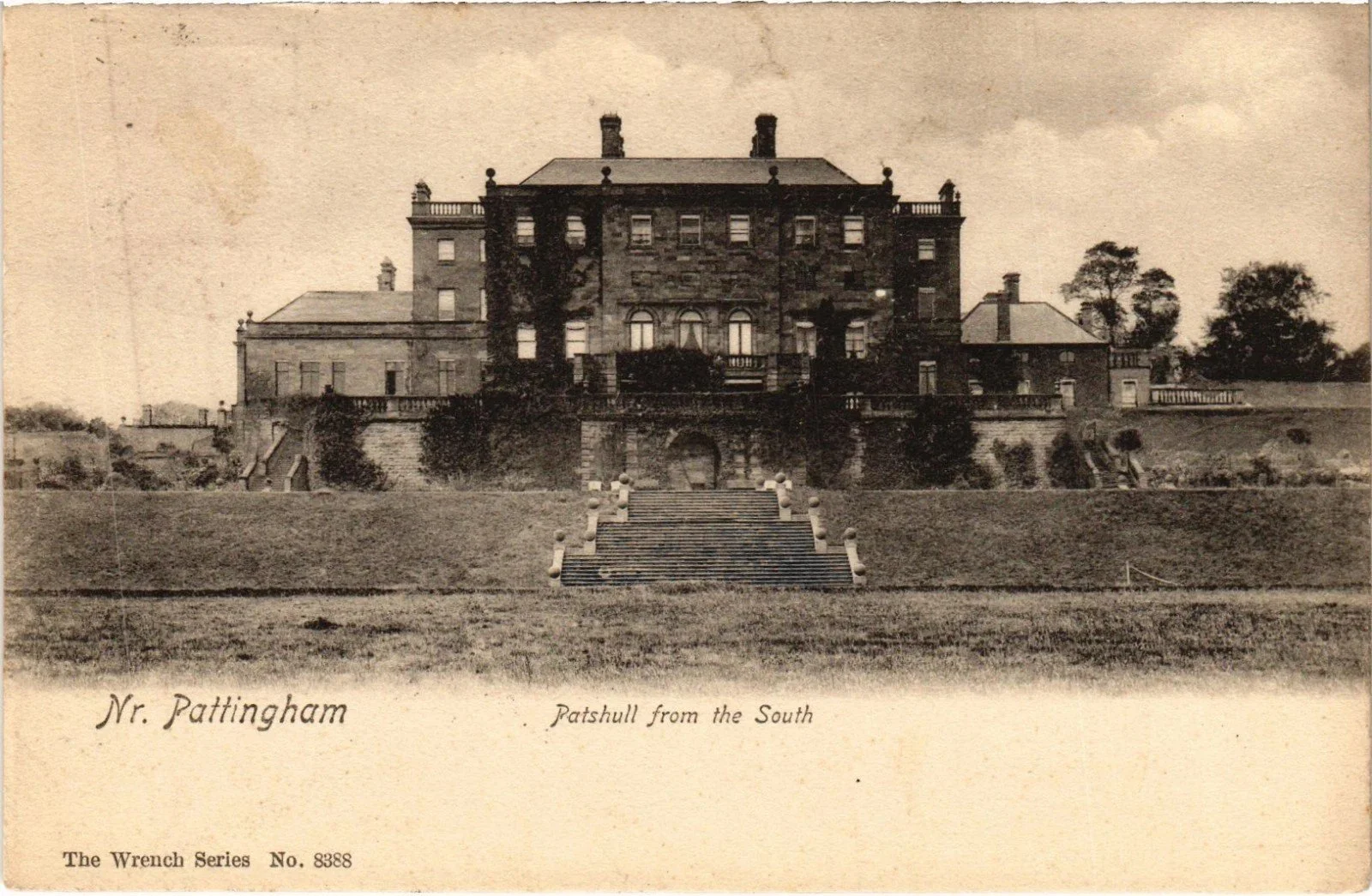 Patshull Hall, viewed from the south, showing the recessed arch and Italianate staircase featured in the Patshull photographs. Postcard. Author's own collection.