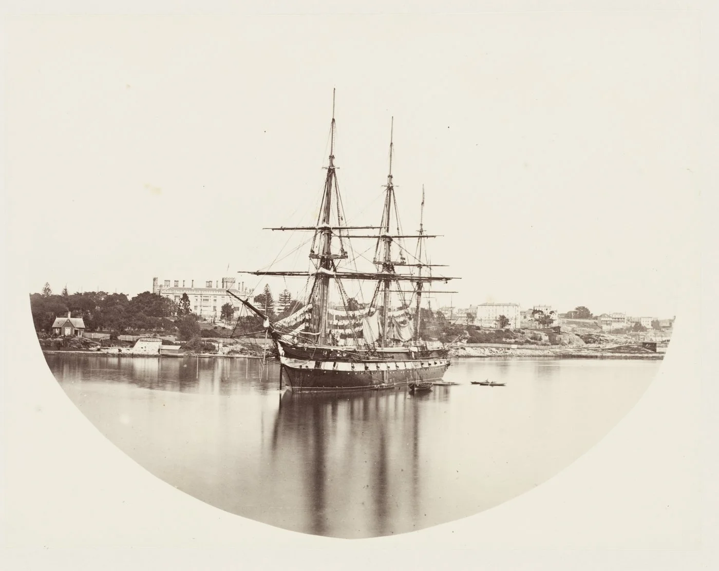 HMS "Galatea" in Farm Cove; Government House to the left, c. 1870, [attributed Charles Pickering], from albumen print published in "A collection of photographs of buildings and views in New South Wales," Thomas Richards, Government Printer, 1873, Sta