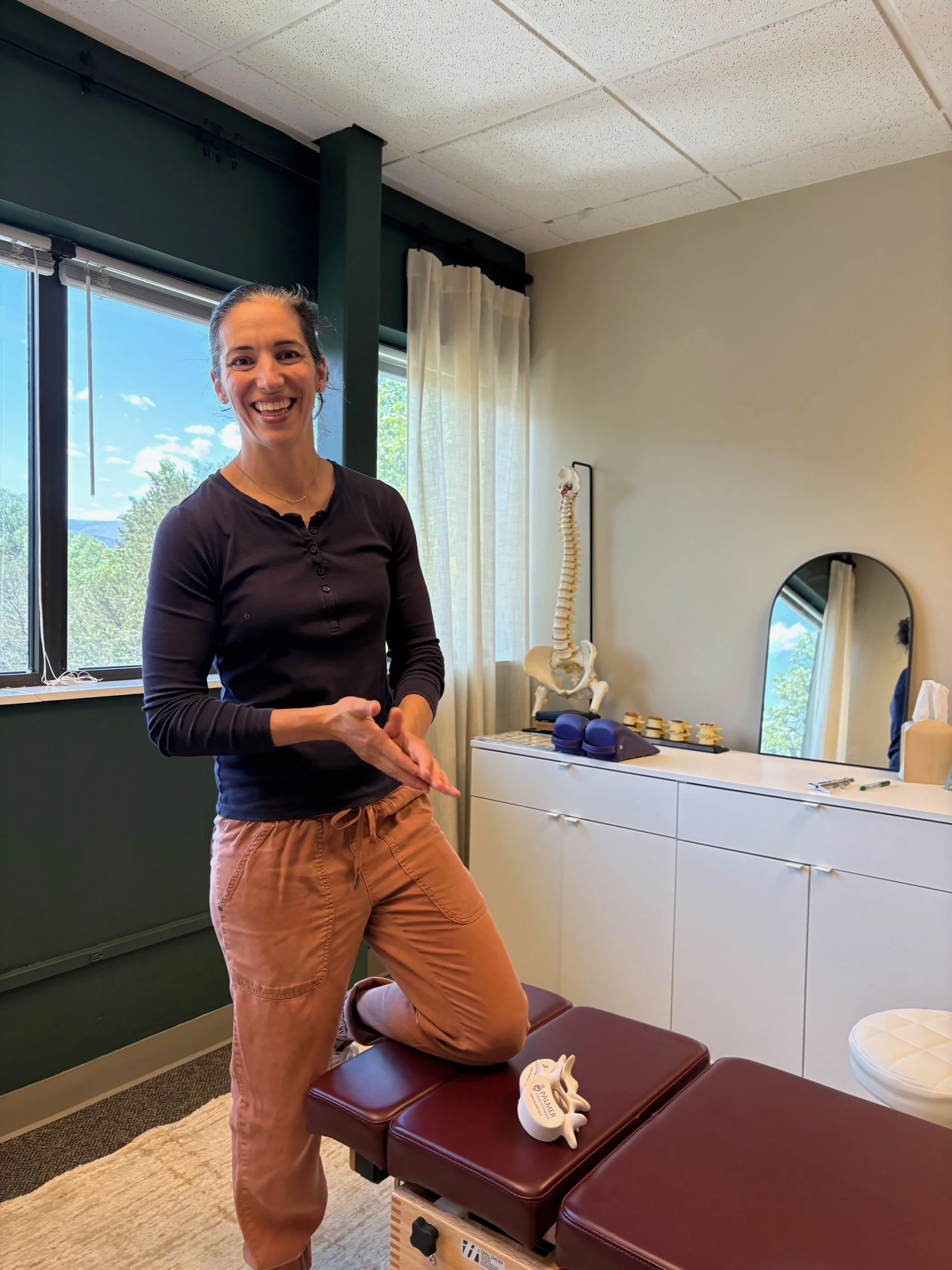 Dr. Leslie in the treatment room at Destination Chiropractic in Boulder