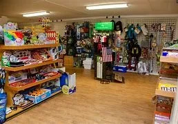 Pet store interior with shelves displaying various pet supplies and accessories.
